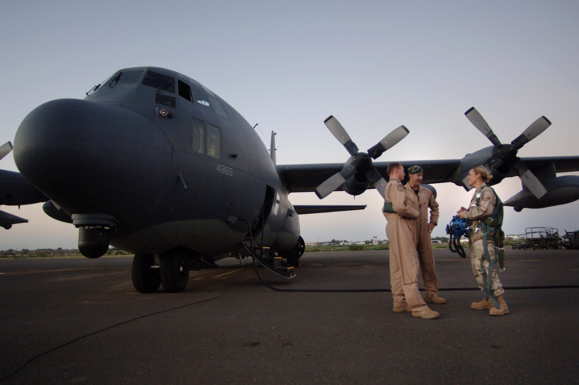 Staff Sgt. Elizabeth Eggel chats with HC-130 navigator Capt. Jesse Enfield and co-pilot 1st Lt. Tim Saxton before a refueling mission Dec 17. As the only life support technician deployed to the Horn of Africa, the six-year veteran from Davis-Monthan Air Force Base, Ariz., provides support to more than 40 Air Force, Navy and Marine aircrew members based at Camp Lemonier, Djibouti. (U.S. Air Force photo/Master Sgt. Scott Wagers)