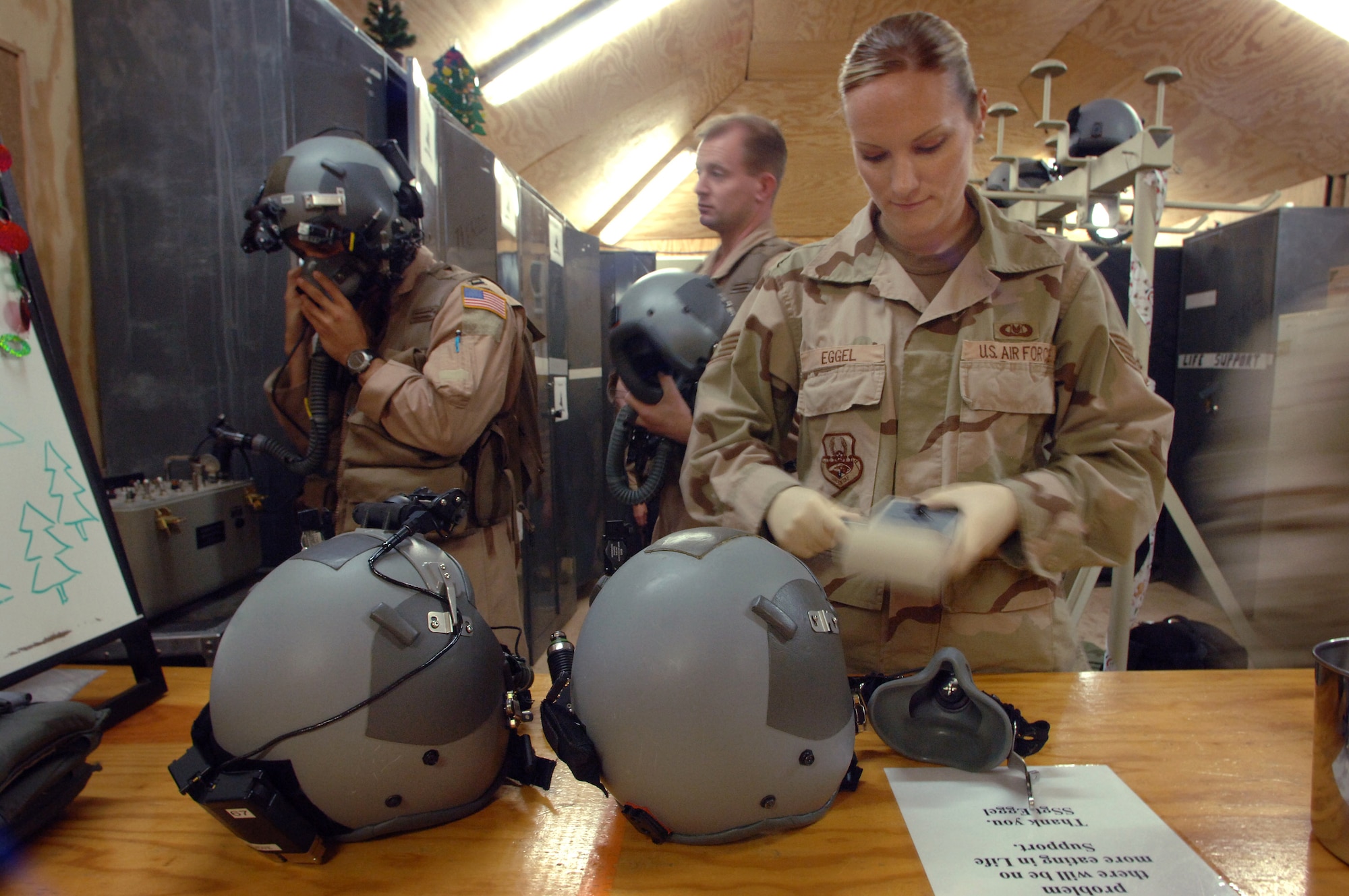 Staff Sgt. Elizabeth Eggel conducts periodic maintenance inspections on crew helmets before a refueling mission Dec 17. As the only life support technician deployed to the Horn of Africa, the six-year veteran from Davis-Monthan Air Force Base, Ariz., provides support to more than 40 Air Force, Navy and Marine aircrew members based at Camp Lemonier, Djibouti. (U.S. Air Force photo/Master Sgt. Scott Wagers)

