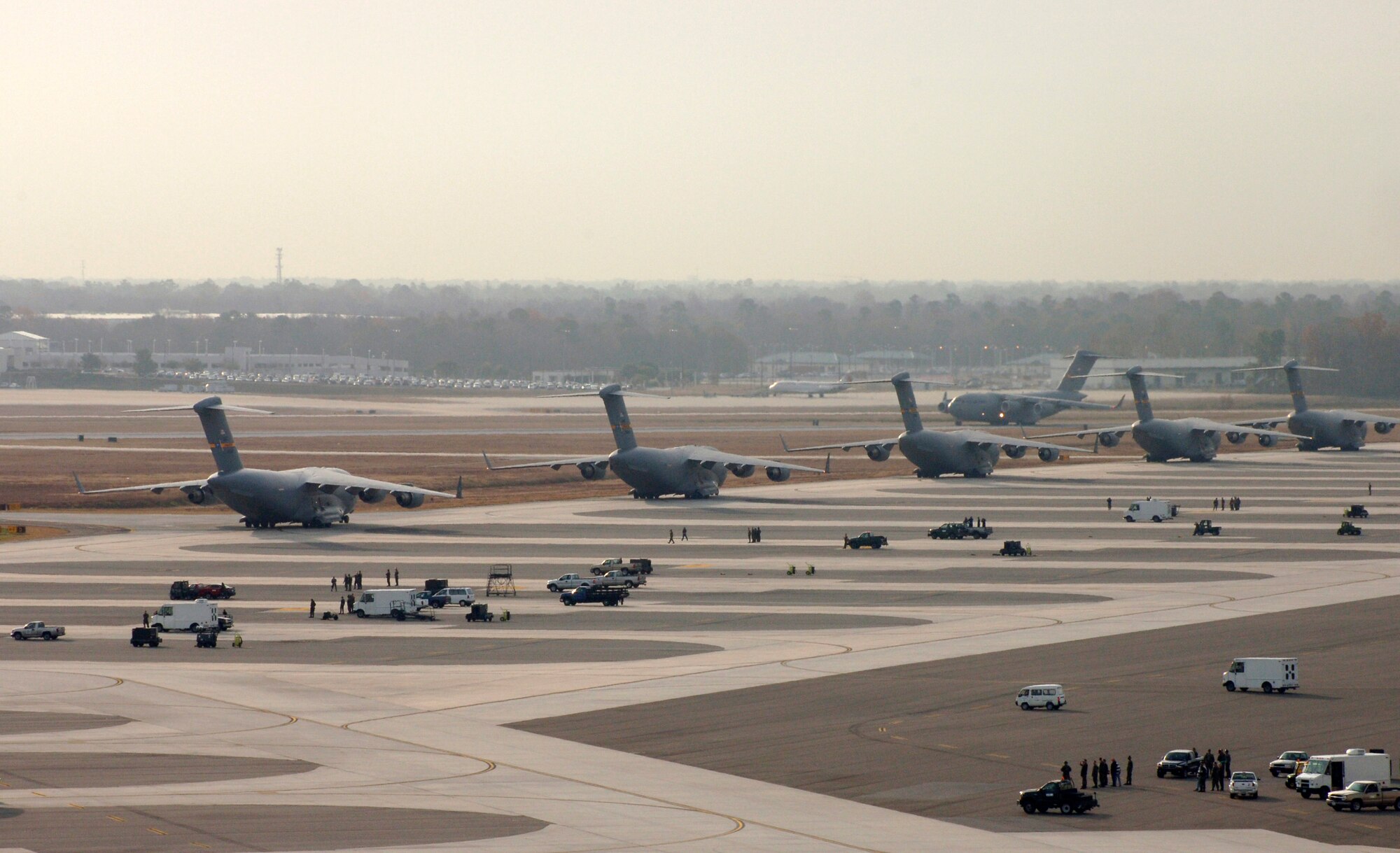 C-17 Globemaster III's prepare for takeoff Dec. 21 at Charleston Air Force Base, S.C. The C-17 is capable of rapid, strategic delivery of troops and all types of cargo. The design of the aircraft allows it to operate on small, austere airfields. It can take off and land on runways as short as 3,500 feet and 90 feet wide. (U.S. Air Force photo/Staff Sgt. April Quintanilla) 