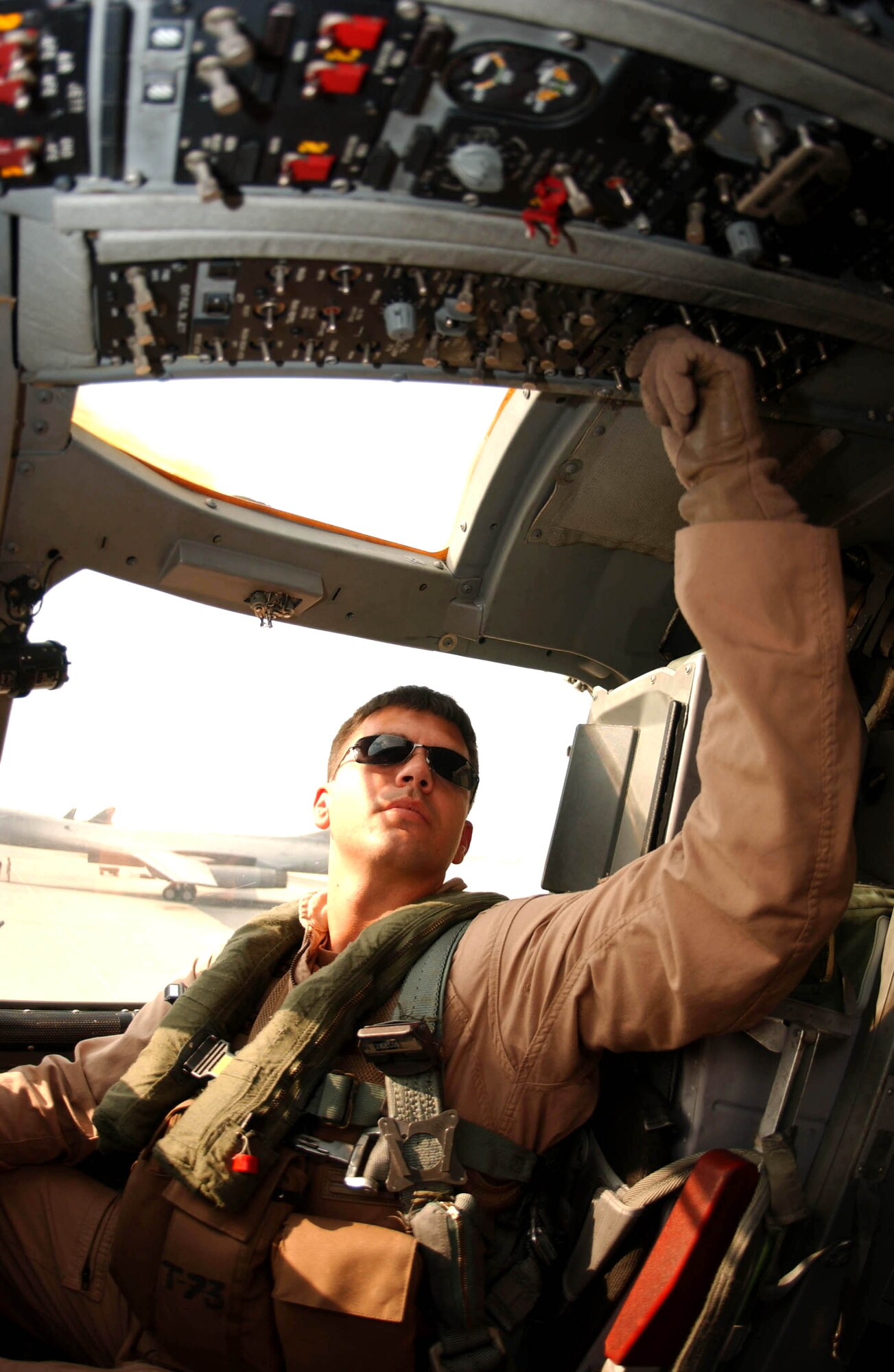 Capt. David Grasso, a B-1B Lancer pilot performs a pre-fight check recently before flying a 12-hour nighttime close-air support mission over Afghanistan. Captain Grasso is assigned to the 37th Expeditionary Bomb Squadron, part of the 379th Air Expeditionary Wing in Southwest Asia. (U.S. Air Force photo/Ricky Best) 