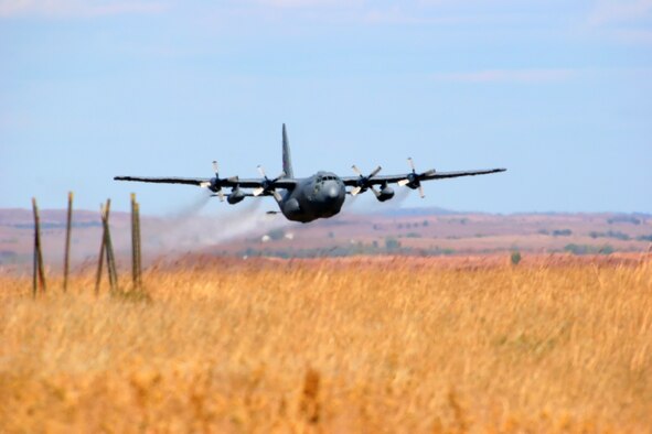 SMOKEY HILL WEAPONS RANGE, Kan.-- An Air Force Reserve aircrew flying a C-130 assigned to the 910th Airlift Wing, Youngstown Air Reserve Station, Ohio conducts an aerial spray mission here Nov. 7-9, 2006.  The mission was a herbicide mission to control musk thistle and treated 2,800 acres at the Smokey Hill Weapons Range, located in Salina, Kan.  The Smokey Hill Weapons range is one of several military installations where the 910th conducts aerial spray missions each year to combat biting insects, control problematic vegetation, or practice to respond to an oil spill.