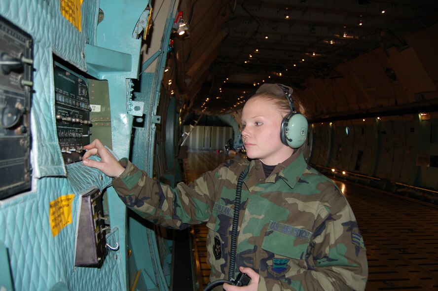 Senior Airman Jessica Wheat, a reserve maintainer with the 433rd Maintenance Group here at Lackland AFB's Kelly Field, performs a lamp test on the loadmaster's aft control panel, part of the aft loading complex. There are thousands of components on a C-5 and each must be in perfect working order to keep the aircraft mission ready at all times. C-5 aircraft from the 433rd Airlift Wing, continually fly missions in support of the Global War on Terror, train aircrews and stand ready to carry relief supplies should disaster strike. (U.S. Air Force photo/Senior Master Sgt. Troy Pearson)