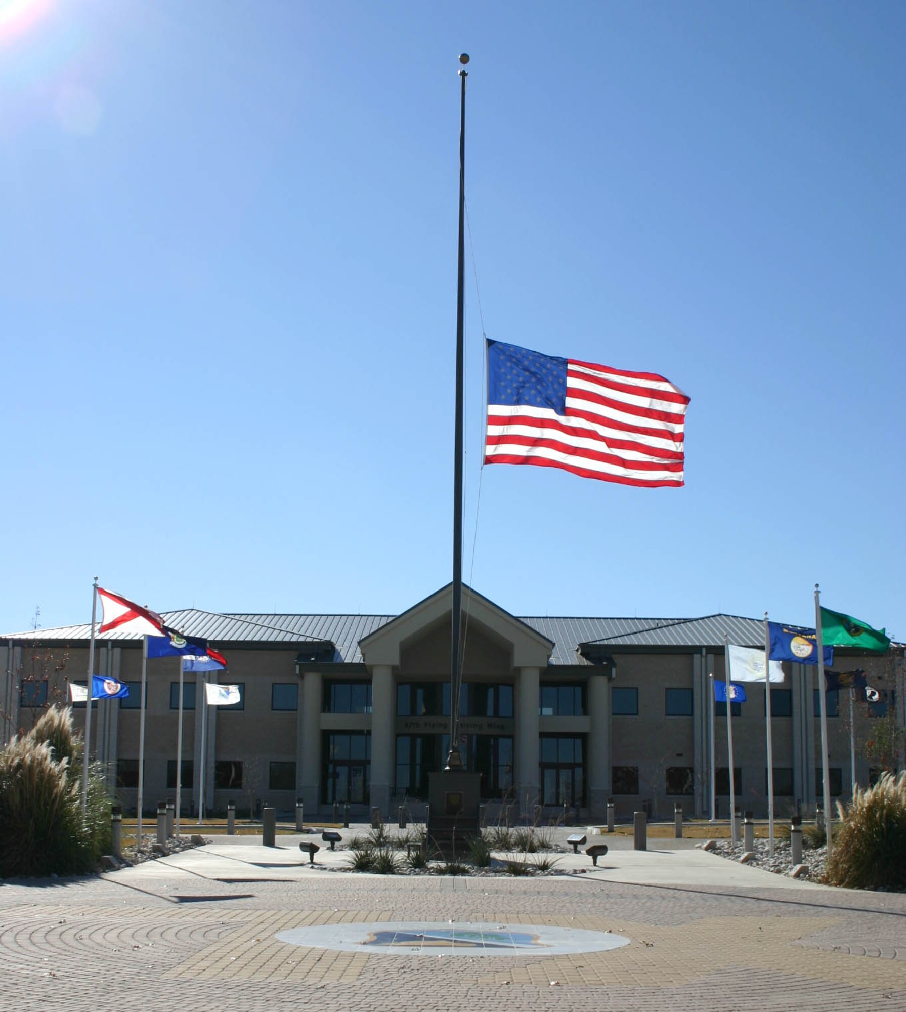 The flag outside the 47th Flying Training Wing headquarters at Laughlin Air Force Base, Texas, flies at half-staff in remembrance of Gerald R. Ford, the 38th president of the United States. (U.S. Air Force photo/2nd Lt. Courtney Kippenberger) 