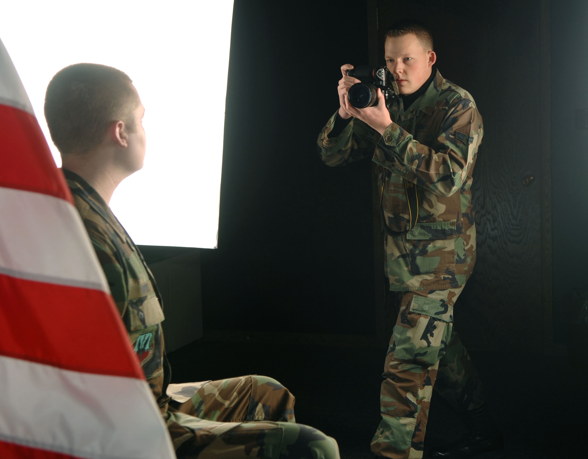 Airman 1st Class Christopher Boitz takes a studio portrait at the multimedia center at Minot Air Force Base, N.D. Airman Boitz is assigned to the 5th Communications Squadron. (U.S. Air Force photo/Airman 1st Class Joe Rivera)