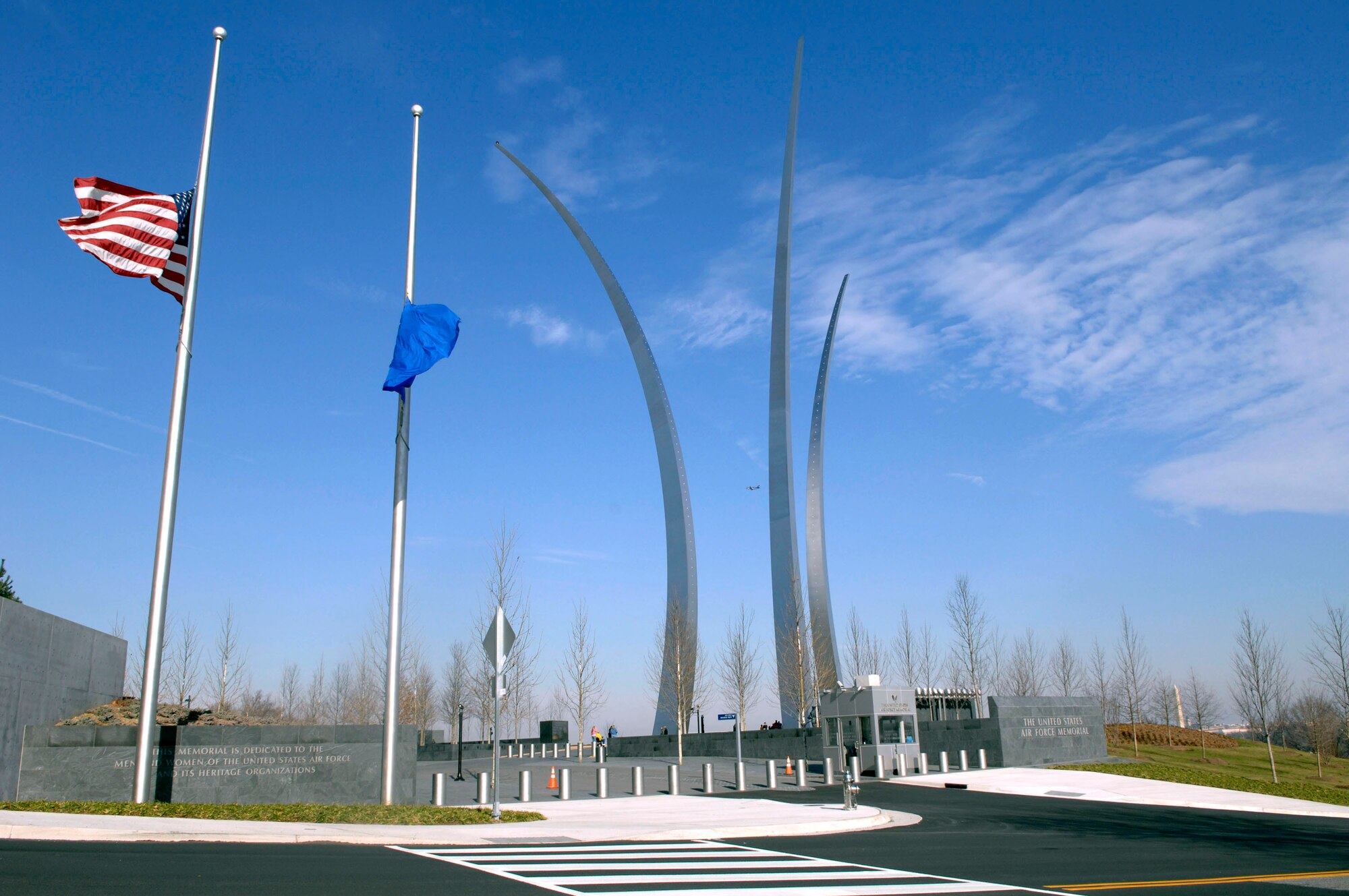 The American flag and the U. S. Air Force flag fly at half staff in front of the Air Force Memorial in Arlington, Va. in honor of President Gerald R. Ford, who passed away Dec. 26 at age 93. During his tenure as president, Ford signed legislation permitting women to enter military academies Oct. 7, 1975. Women first entered the United States Air Force Academy on June 28, 1976. He will be laid to rest Jan. 2 on the grounds of the Gerald R. Ford Presidential Museum in Grand Rapids, Mich., the president's hometown. (U. S. Air Force photo/Tech Sgt. Cohen A. Young)
