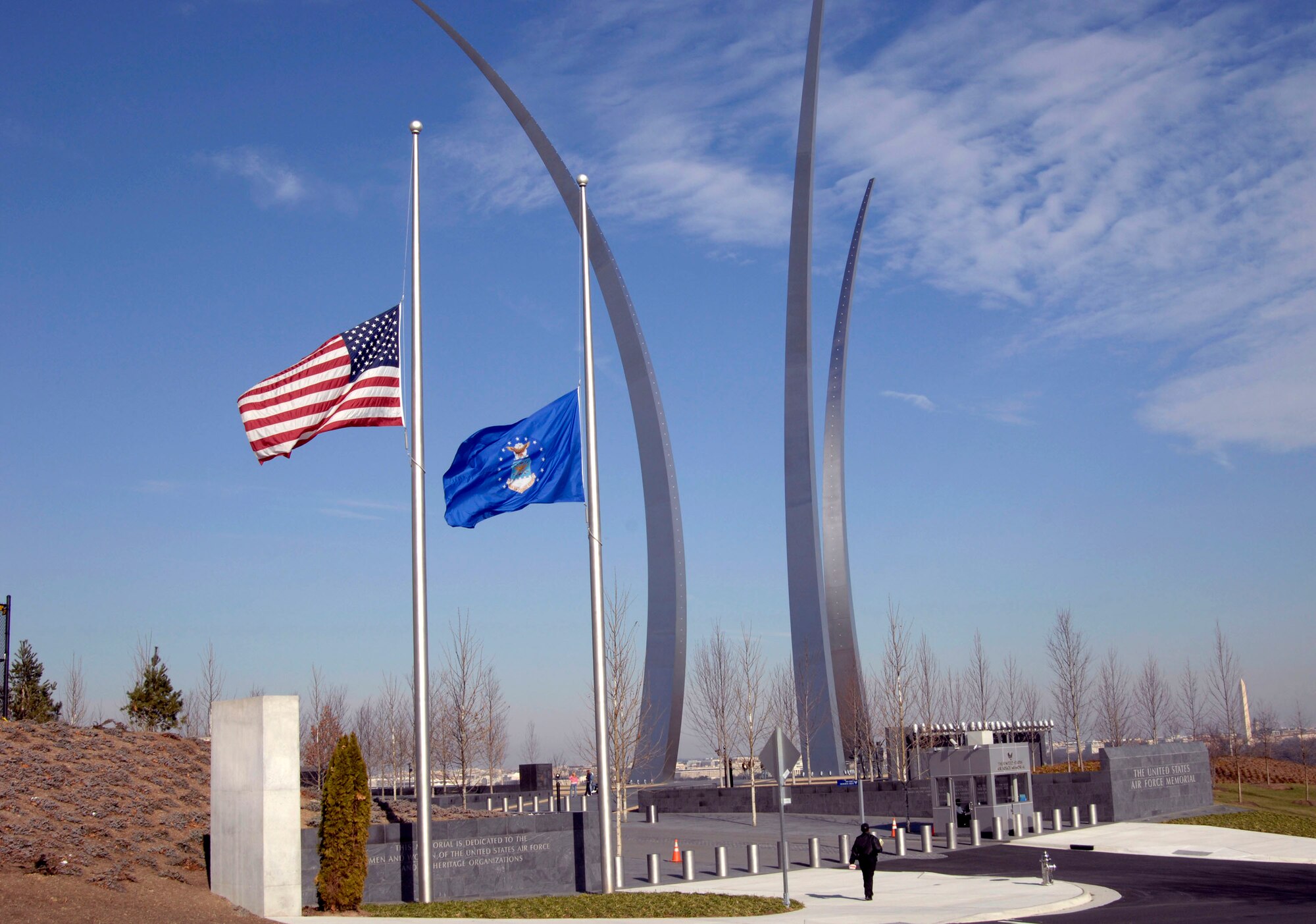 The American flag and the U. S. Air Force flag fly at half staff in front of the Air Force Memorial in Arlington, Va. in honor of President Gerald R. Ford, who passed away Dec. 26 at age 93. During his tenure as president, Ford signed legislation permitting women to enter military academies Oct. 7, 1975. Women first entered the United States Air Force Academy on June 28, 1976. He will be laid to rest Jan. 2 on the grounds of the Gerald R. Ford Presidential Museum in Grand Rapids, Mich., the president's hometown. (U. S. Air Force photo/Tech Sgt. Cohen A. Young)