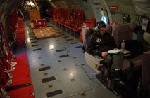EIELSON AIR FORCE BASE, Alaska -- Major Richard Mooney, a flight doctor with the 354th Medical Operations Squadron, 354th Medical Group, 354th Fighter Wing, Eielson Air Force Base, Alaska, takes a minute to read in a KC-135 Stratotanker prior to take off for a refueling mission on Feb 10, 2005. The 168 ARW is the only Arctic-region refueling unit for all of PACAF, and maintains a substantial number of personnel on active duty and civilian technician status in order to meet its daily operational requirements.
(U.S. Air Force Photo by Senior Airman Joshua Strang)