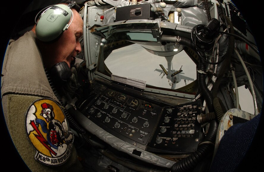 EIELSON AIR FORCE BASE, Alaska -- Master Sgt Keith Henrys, a KC-135 boom operator, 168th Air Refueling Squadron, 168th Air Refueling Wing, Alaska Air National Guard, Eielson Air Force Base, Alaska, watches as a Navy F/A-18F Super Hornet from VFA-41 "Black Aces", home based at NAS Lemoore, California, uses a Drogue type refueling system during a refueling mission on 21 July 2004 by a KC-135R Stratotanker belonging to the Alaska Air National Guard, during exercise Cooperative Cope Thunder 2004-01. Cope Thunder is a multi-service, multi-platform coordinated, combat operations exercise and corresponds to the designed operational capability of participating units.
(U.S. Air Force Photo by Senior Airman Joshua Strang)