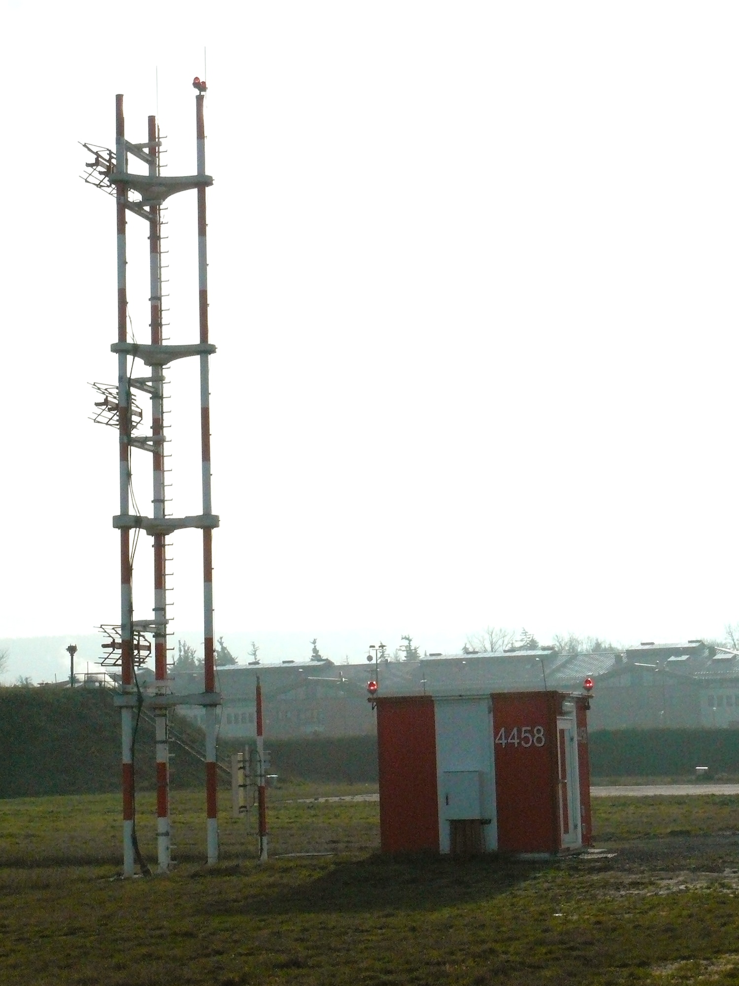 The glide scope equipment part of the CAT II instrument landing system allows aircraft and crews to land in very low-visibility conditions at Ramstein Air Base, Germany. The airfield sends a signal notifying incoming aircraft to altitude information during CAT II and CAT III conditions. (U.S. Air Force photo/Capt. Erin Dorrance) 
