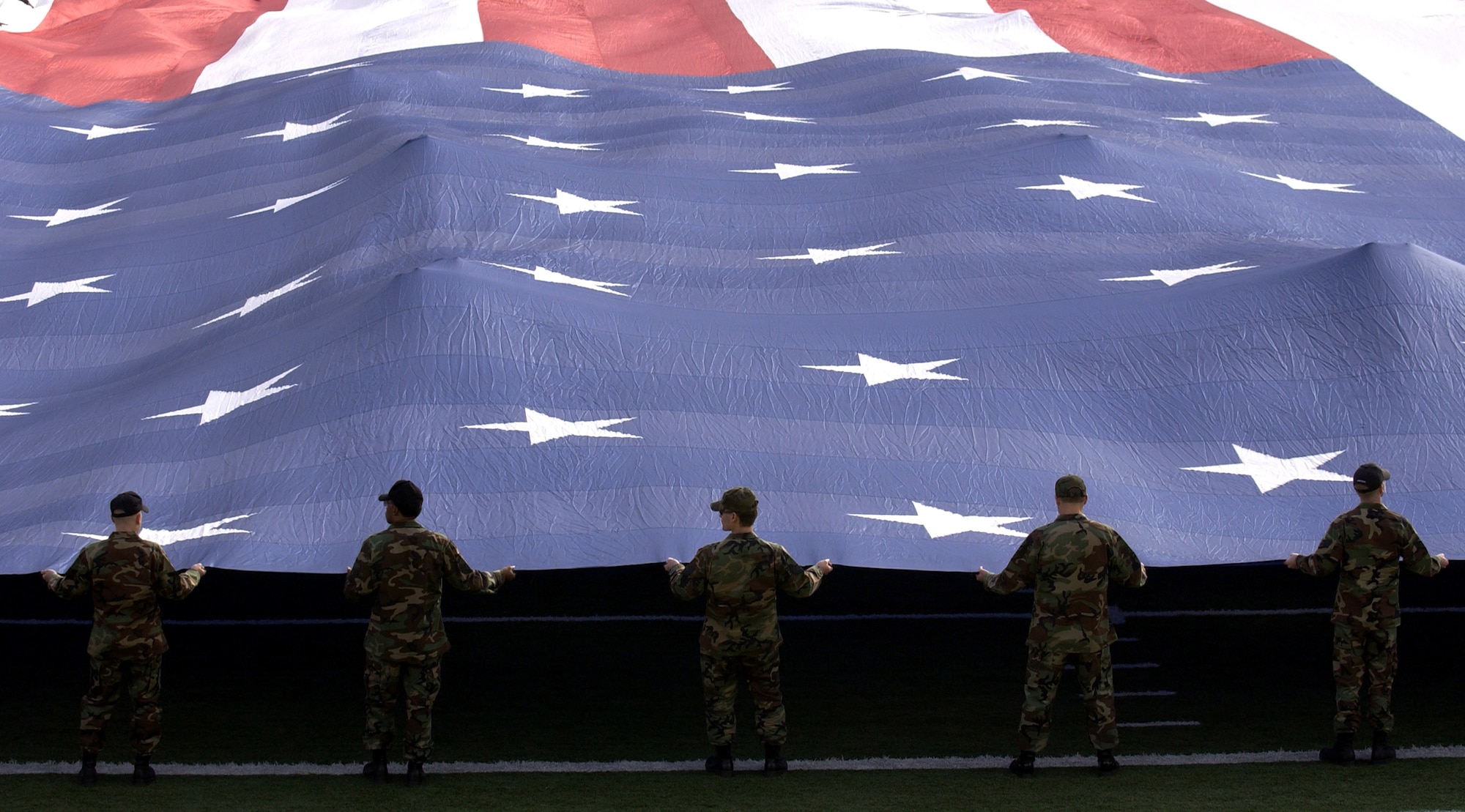 Airmen present the American flag during the national anthem Dec. 21 at the Pioneer PureVision Las Vegas Bowl. The nationally televised football game featured the Brigham Young University Cougars and the University of Oregon Ducks at Sam Boyd Stadium, Las Vegas. The Airmen are from Nellis Air Force Base, Nev. (U.S. Air Force photo/Master Sgt. Kevin J. Gruenwald)


USAF Photo by: Master. Sgt. Kevin J. Gruenwald
(released)             
