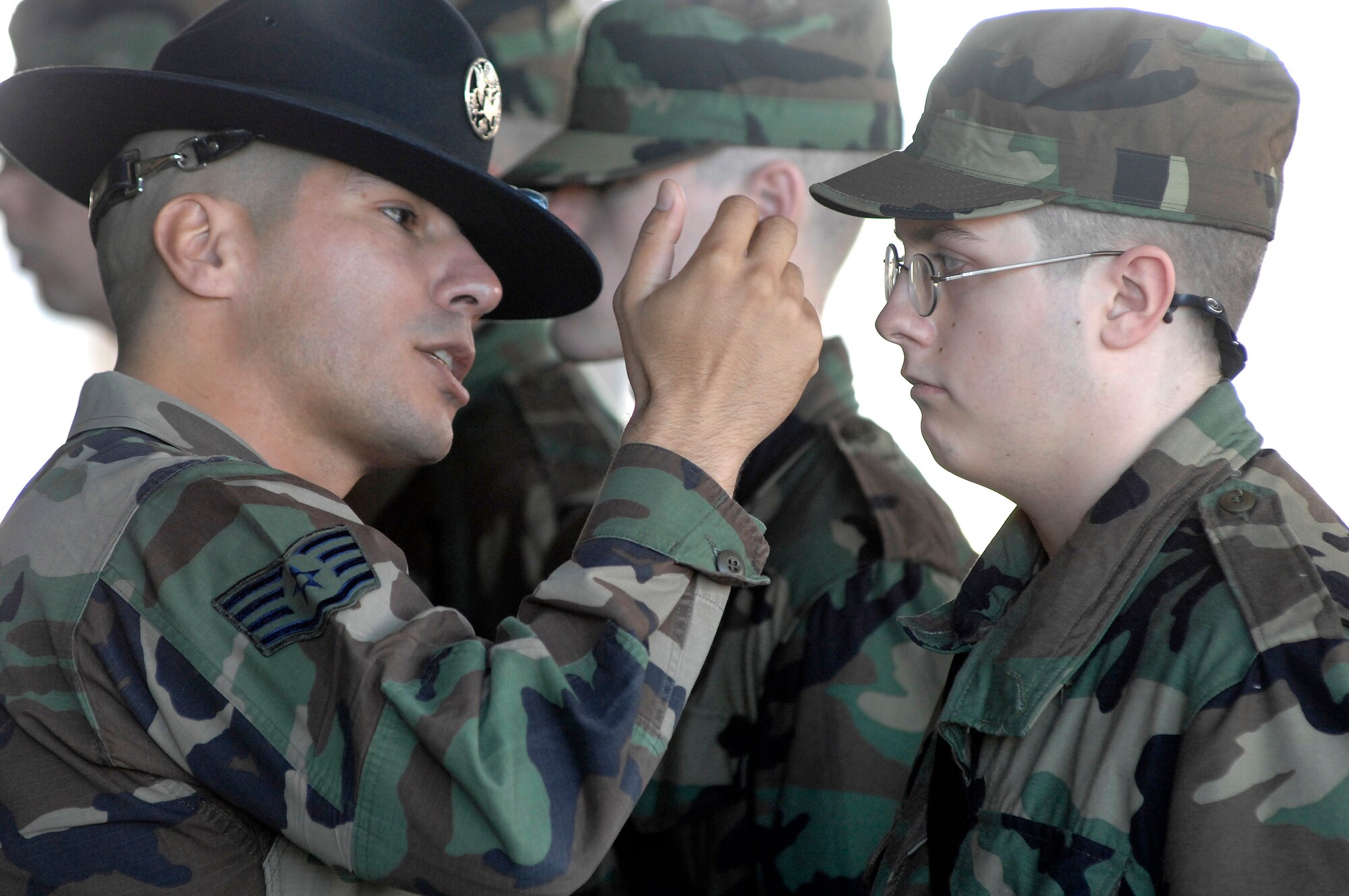 Staff Sgt. Jacob Chavez corrects a trainee during a drill practice Dec. 27 at the 322nd Training Squadron at Lackland Air Force Base, Texas. Sergeant Chavez is a military training instructor who is spending his holidays training new Airmen. (U.S. Air Force photo/Senior Airman Brian Ferguson)