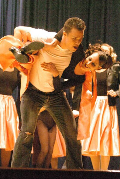 Grease:
Cats … Evita … Grease … Chicago … all Broadway musicals that were featured Dec. 28 during the Showstoppers production of A Trip Through Broadway. 
The show took more than 340 audience members through 11 different shows all put together by Showstoppers. (U.S. Air Force photo by Master Sgt. James Nelson)