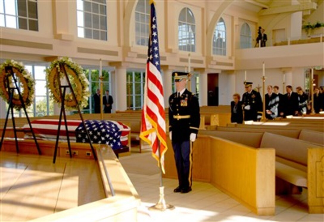 Former First Lady, Mrs. Betty Ford, the widow of President Gerald R. Ford, is escorted by Maj. Gen. Guy C. Swan III during the arrival ceremony at St. Margaret's Episcopal Church in Palm Desert, Calif., Dec. 29, 2006.