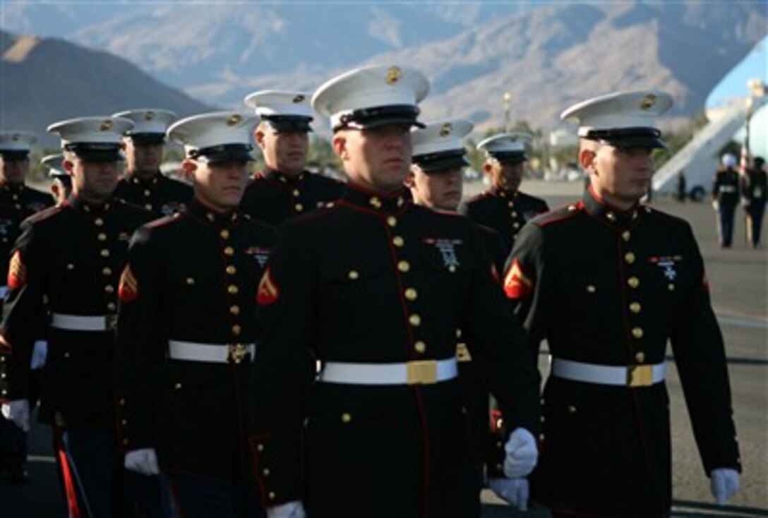 Members of the Armed Forces Honor Guard march in unison during the departure ceremony for former president Gerald R. Ford at the International Airport in Palm Springs, Calif., Dec. 30, 2006.