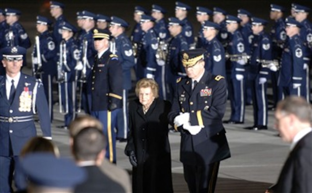 U.S. Army Maj. Gen. Guy C. Swan III, commanding general, Joint Task Force National Capital Region, escorts former First Lady Betty Ford as her husband Gerald R. Ford, 38th President of the United States, arrives in his casket at Andrews Air Force Base, Md., Dec. 30, 2006, as part of the national farewell funeral procession honoring the former commander in chief.
