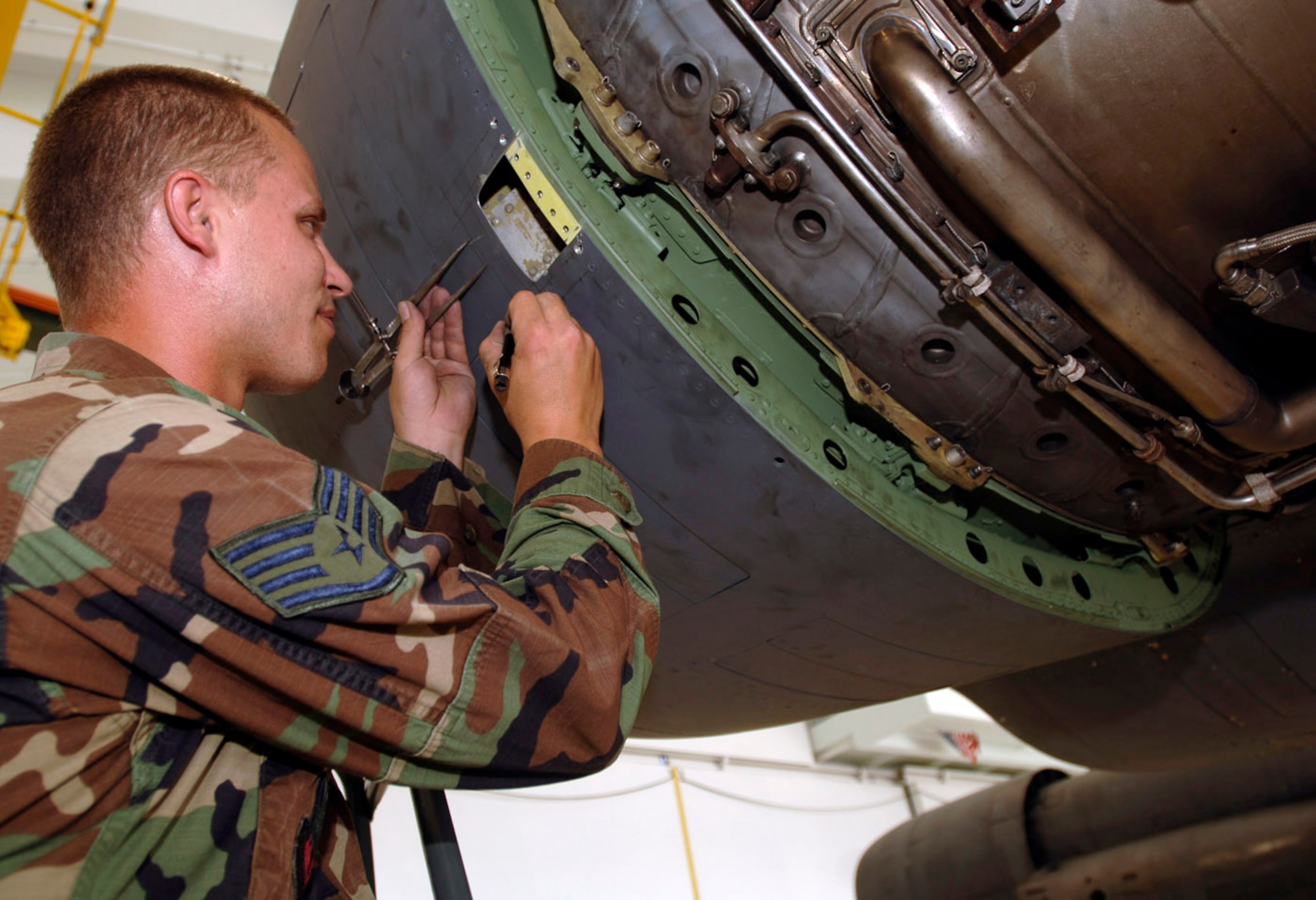 ANDERSEN AIR FORCE BASE, Guam (AFPN) -- Staff Sgt. Matthew Foley works to repair a damaged engine cover on a B-52 Stratofortress Jan. 31. The B-52s return to Andersen from a forward operating location after flying 300 hours. (U.S Air Force photo by Staff Sgt. Bennie J. Davis III) 



