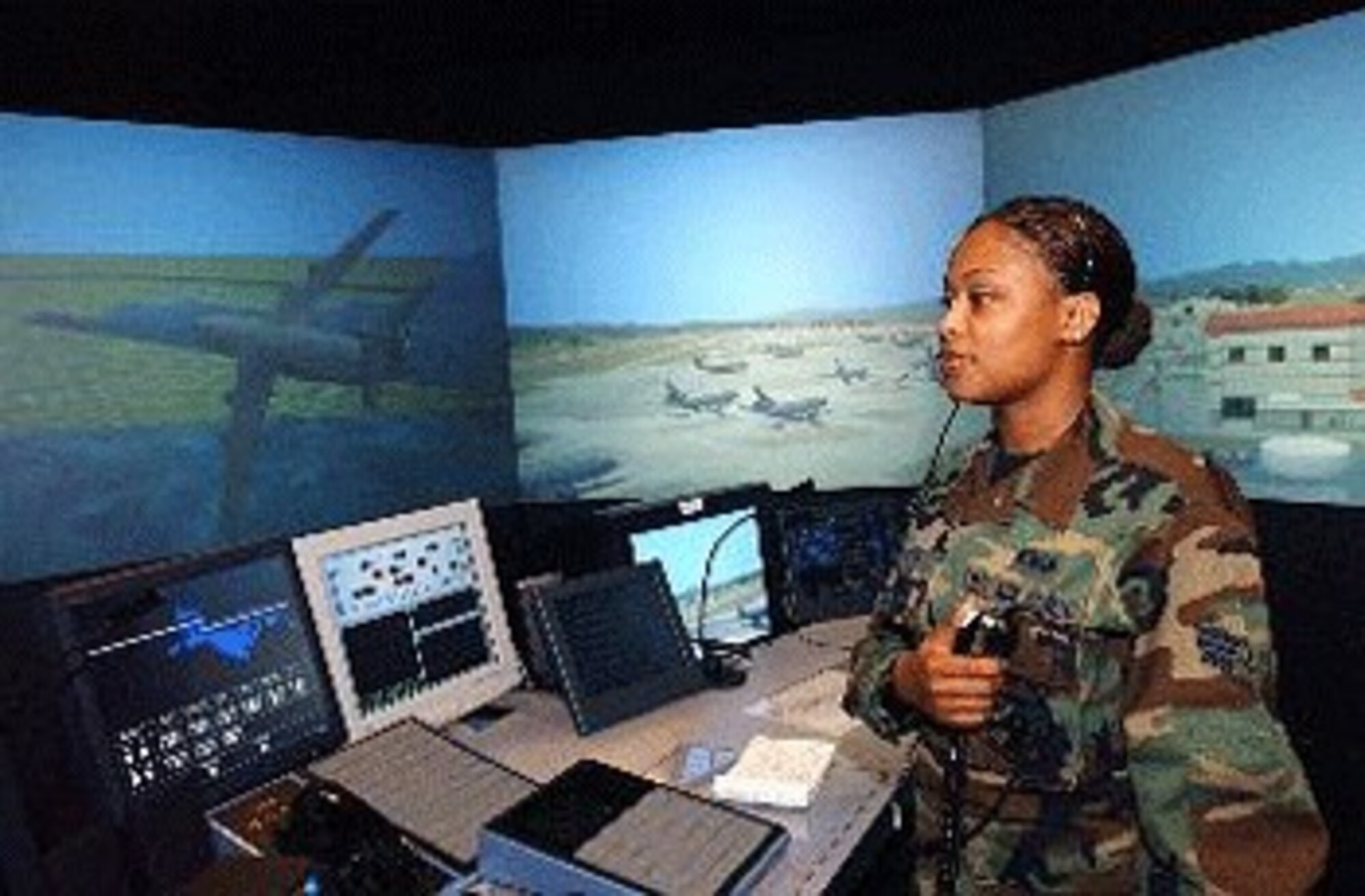 Senior Airman Tiequanda Hayes, 60th Operations Support Squadron, performs training on the air traffic control simulator. The simulator replicates the tower environment by providing a visual representation of the Travis airfield, which allows for in-depth, realistic training for air traffic controllers.