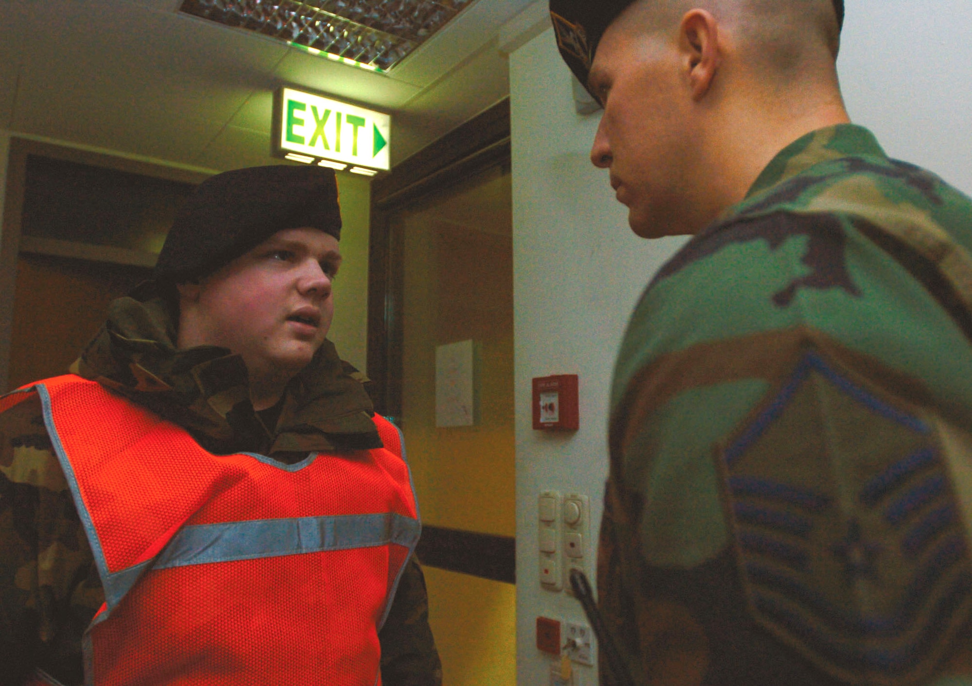 SPANGDAHLEM AIR BASE, Germany (AFPN) -- Airman 1st Class Chad Roberts rattles off a post report to Master Sgt. Clay Christiansen. Airman Roberts is a gate installation access controller, and Sergeant Christiansen is an on-duty flight sergeant. They are assigned to the 52nd Security Forces Squadron. (U.S. Air Force photo by Senior Airman Amaani Lyle)