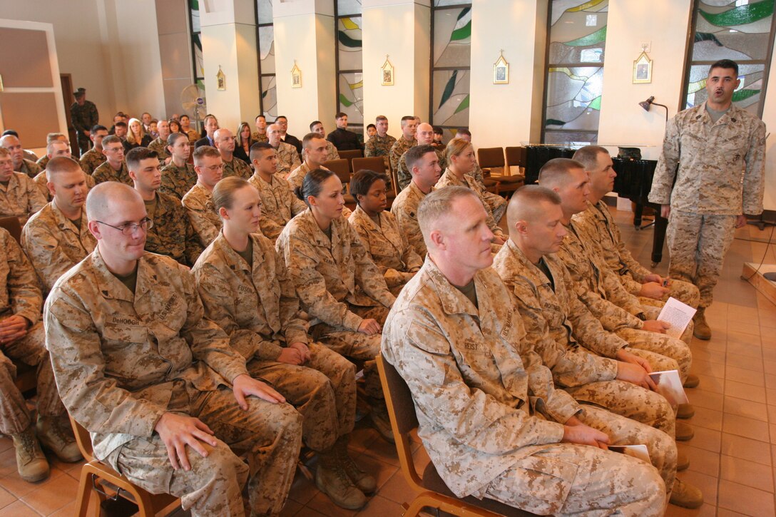 050131-M-7082F-002 CAMP PENDLETON, Calif. -- Master Gunnery Sgt. Arturo Ramirez (standing) conducts final roll call at a memorial service in Cpl. Justin L. Huff's honor. After calling the names of several present Marines, Huff's name was called three times and when no answer came, taps was played. Huff's body was found Jan. 13 buried in North Carolina. Huff is survived by his his wife Rebecca, their unborn child and his parents Blaine and Theresa. Ramirez is the intelligence chief for Brigade Service Support Group- 1, 1st Marine Logistics Group. (Official U.S. Marine Corps photo by Lance Cpl. Patrick J. Floto)(released)