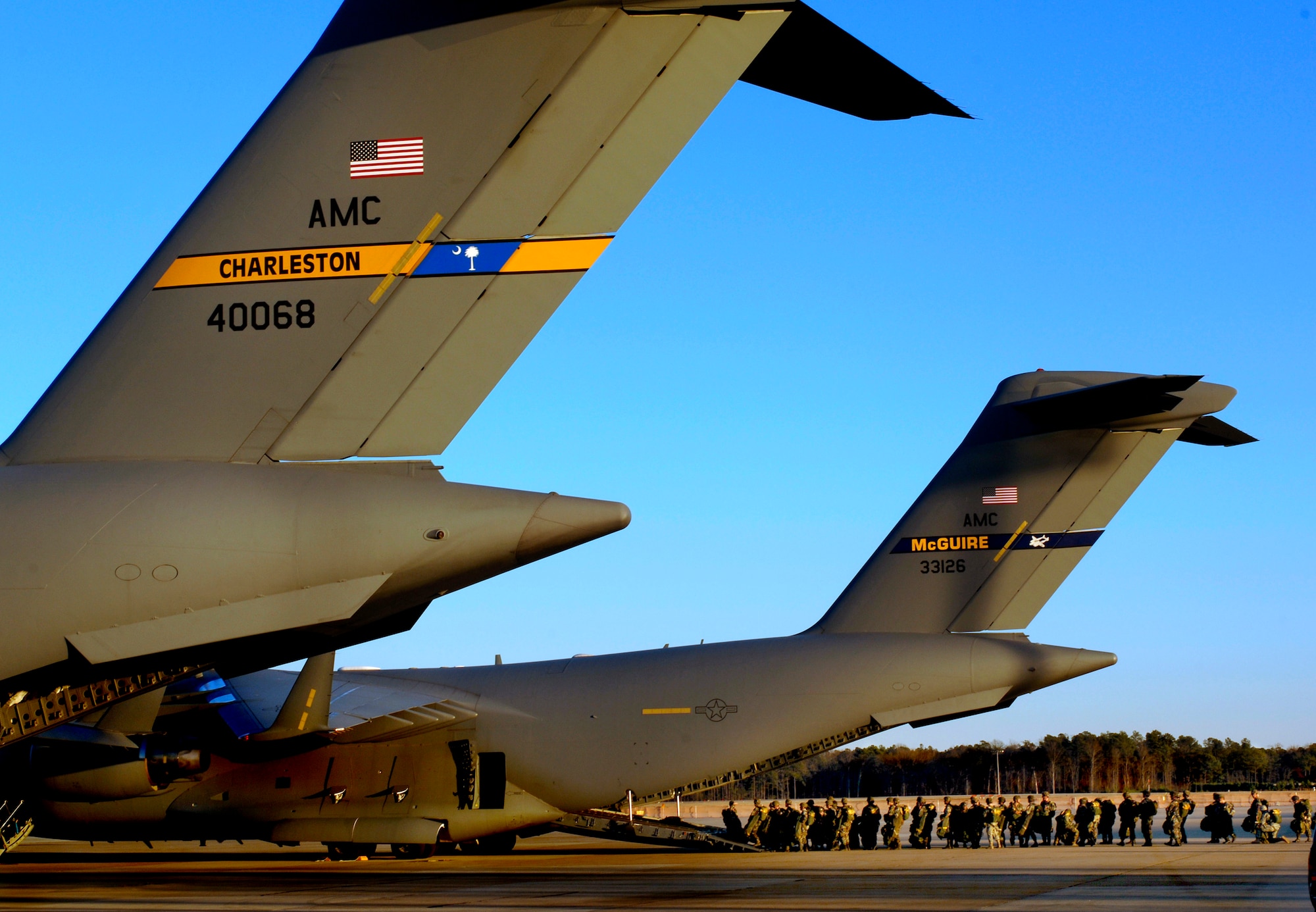 POPE AIR FORCE BASE, N.C. (AFPN) -- Army paratroopers from the 82nd Airborne Division, Fort Bragg, N.C., board a C-17 Globemaster III here. They were jumping into a dropzone as part of a joint forcible entry exercise Jan. 25. (U.S. Air Force Photo by Tech. Sgt. Russell E. Cooley IV)
