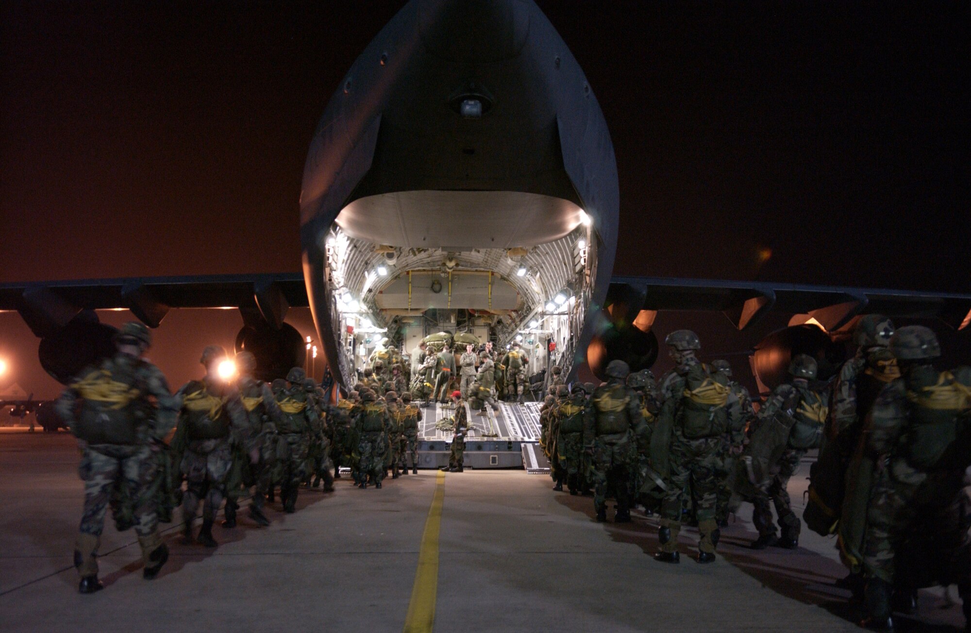 POPE AIR FORCE BASE, N.C. -- Army paratroopers board a C-17 Globemaster III before a night jump during a joint forcible entry exercise Jan. 24. The Soldiers are from the 82nd Airborne Division, Fort Bragg, N.C.  (U.S. Air Force photo by Tech. Sgt. Sean M. Worrell)