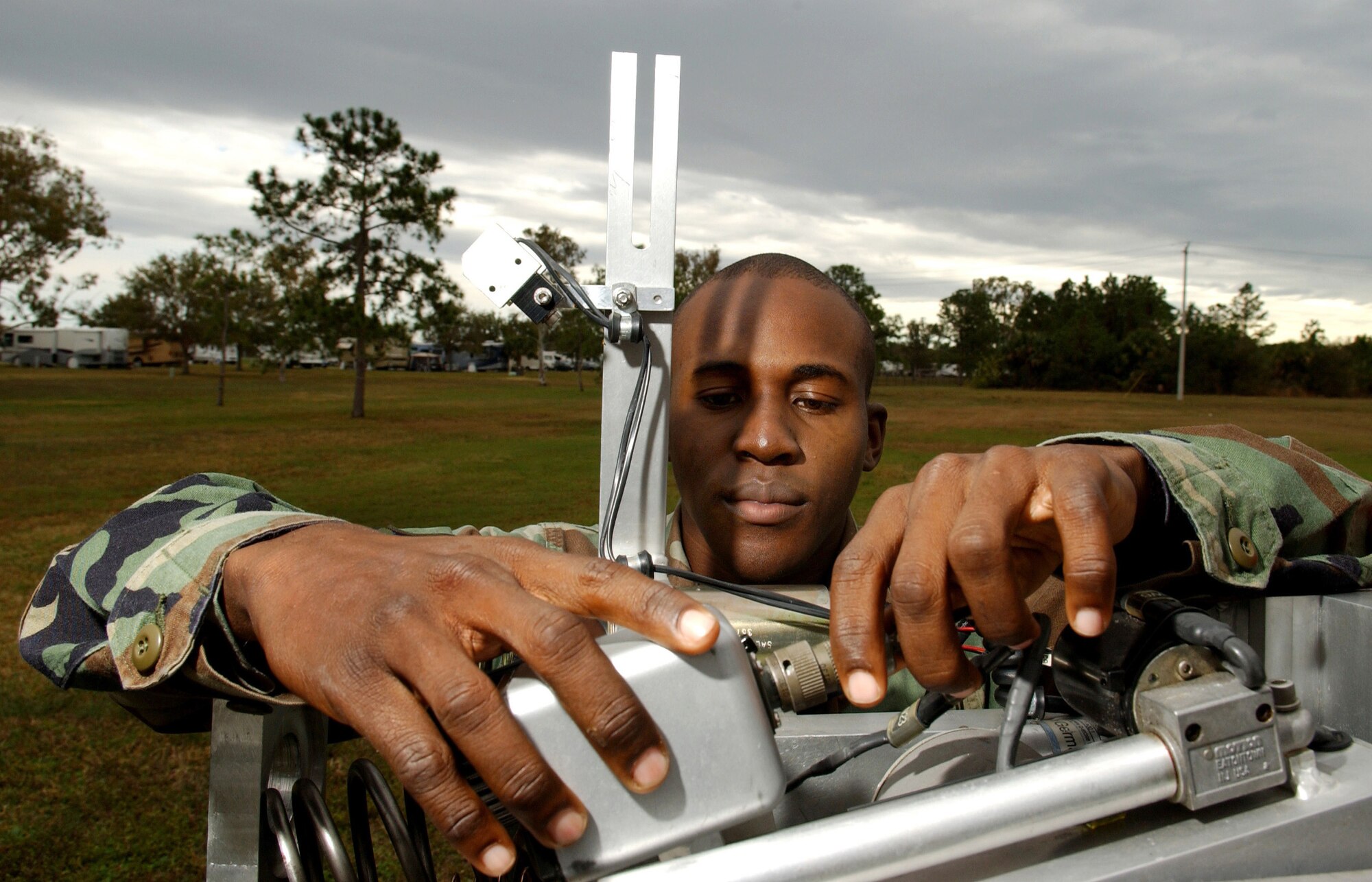 MACDILL AIR FORCE BASE, Fla. (AFPN) -- Senior Airman Wayne Howell does a preventive maintenance inspection here on the fiber optic cables of a remote operated neutralization system, or RONS, Jan. 30. The fiber optic cables connect to the cameras on the RONS, which is used to retrieve explosive devices.  Airman Howell is an explosive ordnance disposal technician with the 6th Civil Engineer Squadron. (U.S. Air Force photo by Airman 1st Class Bradley A. Lail)