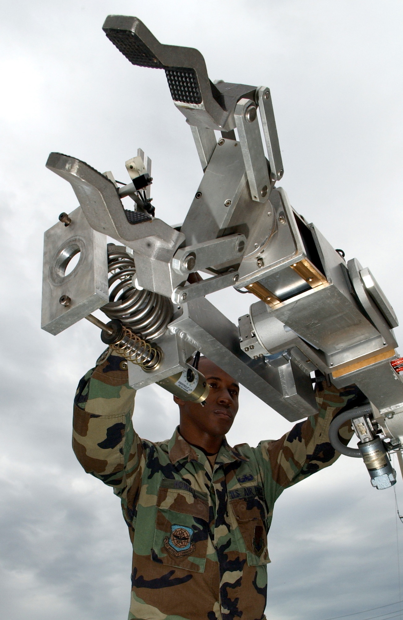 MACDILL AIR FORCE BASE, Fla. (AFPN) -- Senior Airman Wayne Howell does a preventive maintenance inspection here on a remote operated neutralization system Jan. 30. The system is used to retrieve explosive devices.  Airman Howell is an explosive ordnance disposal technician with the 6th Civil Engineer Squadron. (U.S. Air Force photo by Airman 1st Class Bradley A. Lail)