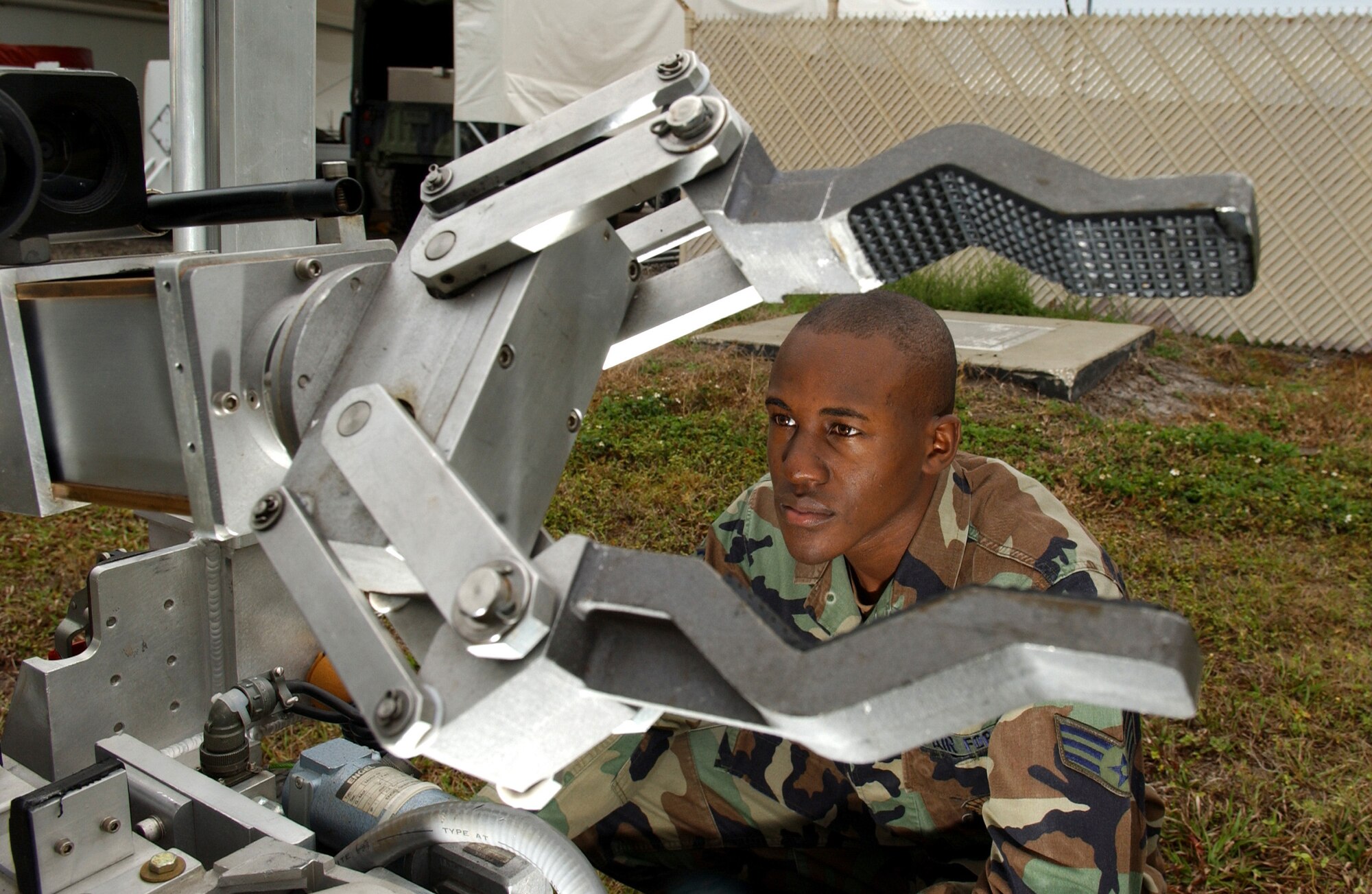 MACDILL AIR FORCE BASE, Fla. (AFPN) -- Senior Airman Wayne Howell does a preventive maintenance inspection here on a remote operated neutralization system Jan. 30. The system is used to retrieve explosive devices.  Airman Howell is an explosive ordnance disposal technician with the 6th Civil Engineer Squadron. (U.S. Air Force photo by Airman 1st Class Bradley A. Lail)
