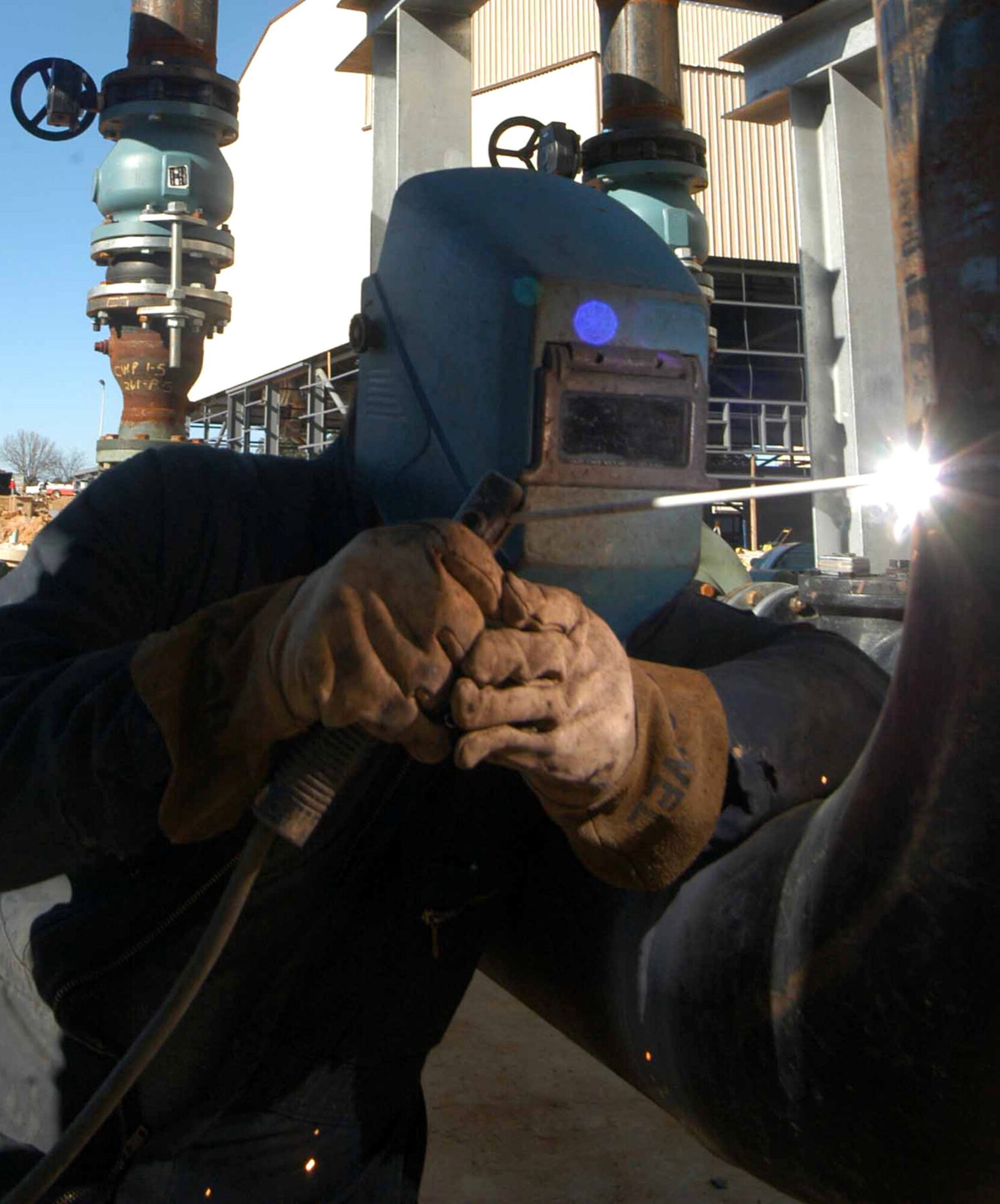 ROBINS AIR FORCE BASE, Ga. (AFPN) -- Dean Hummel welds a cooling unit at the new corrosion control paint and depaint facility now under construction. The facility is scheduled to be completed in March 2007. (U.S. Air Force photo by Sue Sapp) 