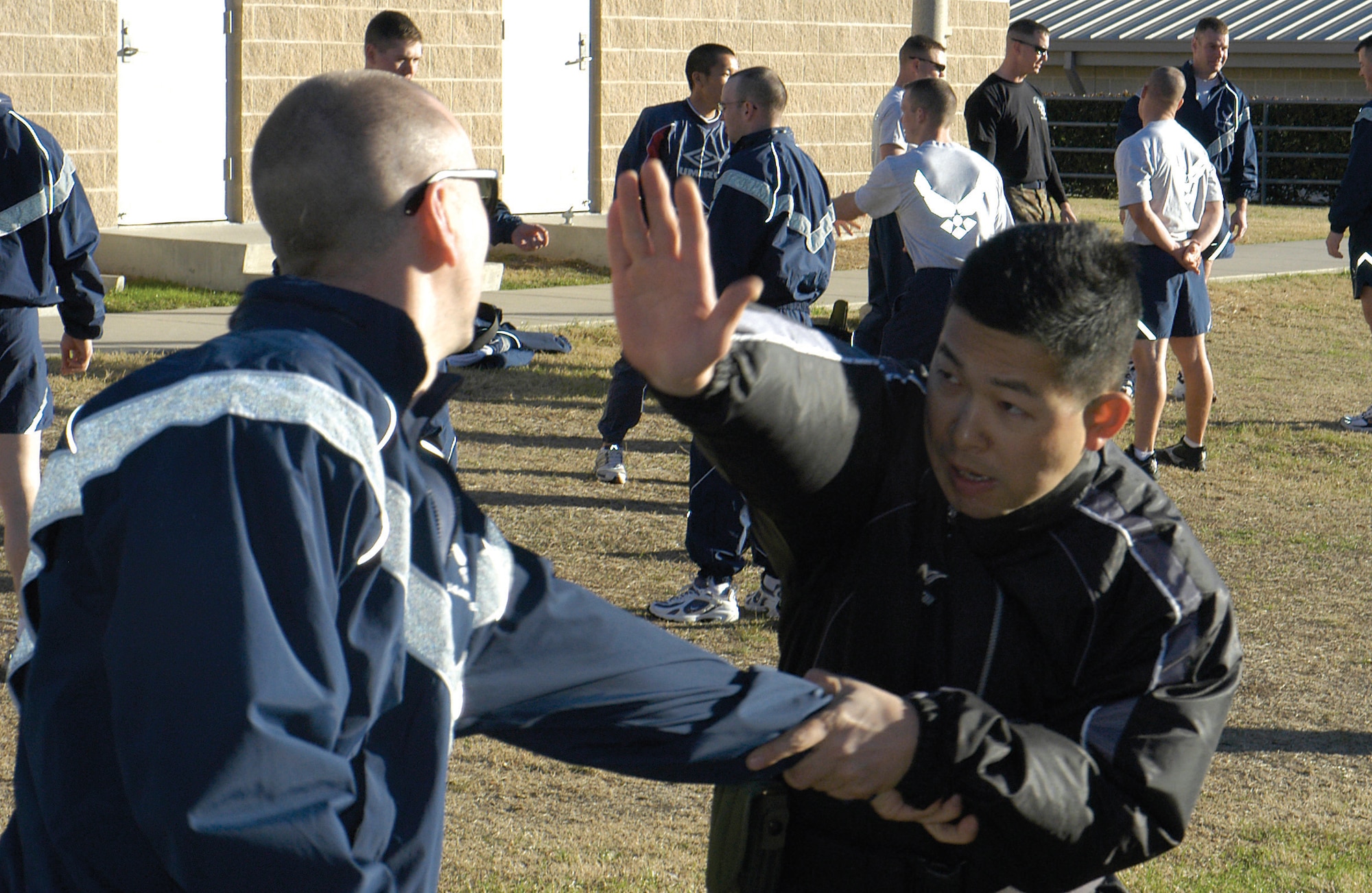 LACKLAND AIR FORCE BASE, Texas (AFPN) -- Japanese officer Maj. Nobukatsu Kishiura practices escaping from a "suspect" using a hand-to-hand combat maneuver during the security forces basic officer course training Jan. 30 at Camp Bullis. (U.S. Air Force photo by James Coburn)