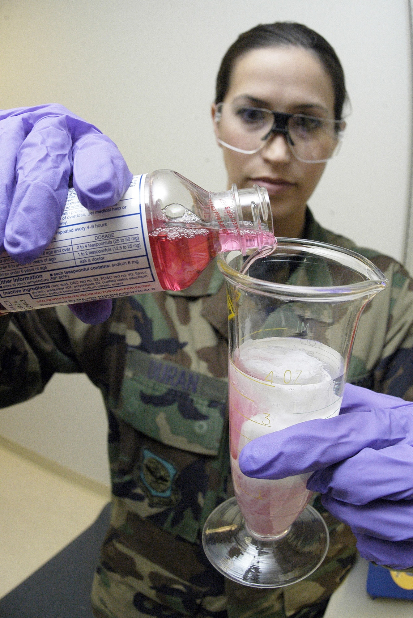 ANDREWS AIR FORCE BASE, Md. (AFPN) -- Senior Airman Mandy Duran mixes a medication compound for a patient. The medication is used to soothe sore throats or cold sores. Although most medications come pre-mixed and packaged, there are some occasions when pharmacists are required to compound medications. Airman Duran is a pharmacy technician with the 89th Medical Support Squadron. (U.S. Air Force photo by Bobby Jones)