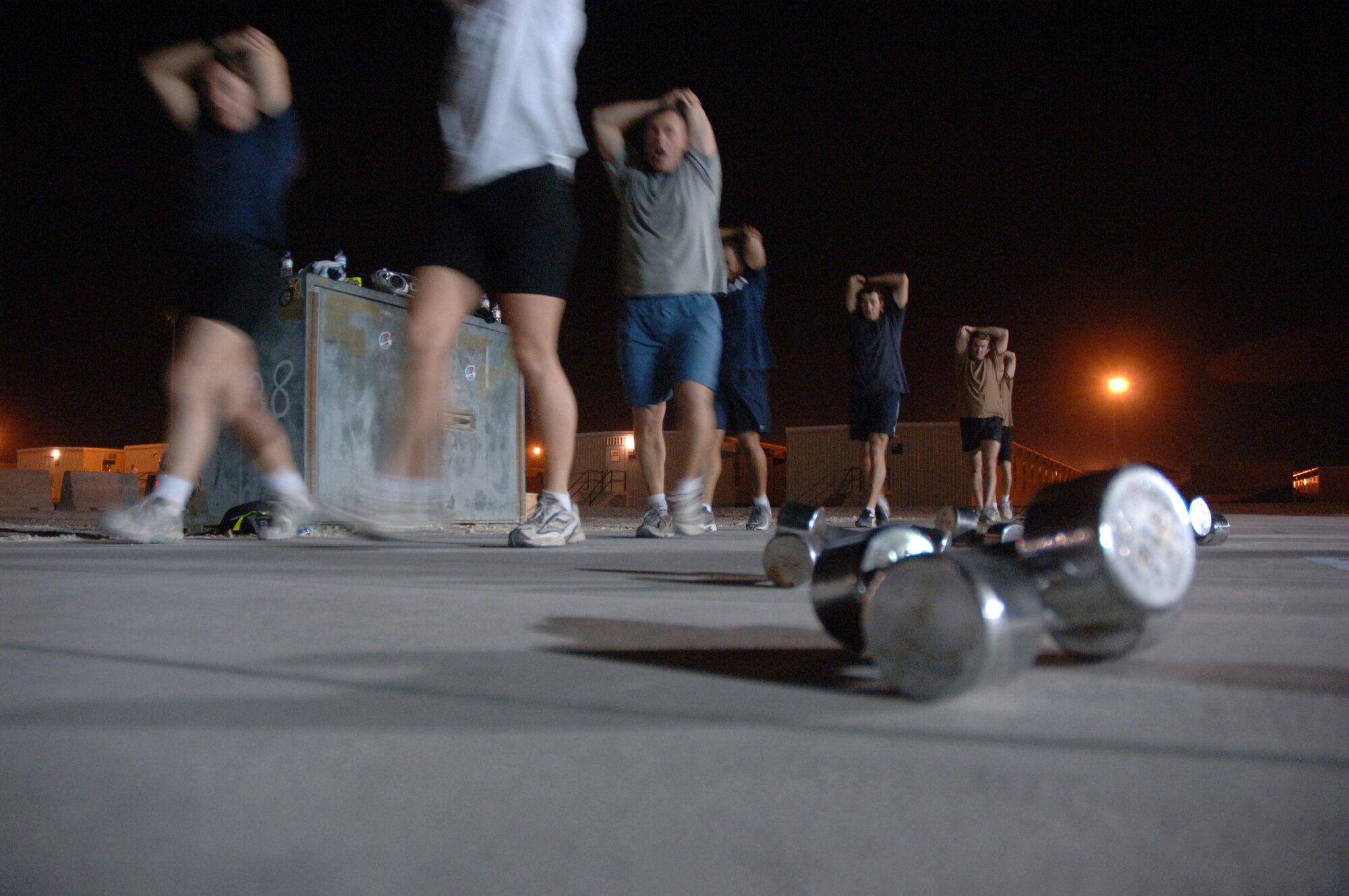 SOUTHWEST ASIA (AFPN) -- Airmen from the United States, England and Australia participate in "combat aerobics" here Feb. 2. The class is offered three nights a week and helps deployed airmen stay in shape. (U.S. Air Force photo by Staff Sgt. Joshua Strang)