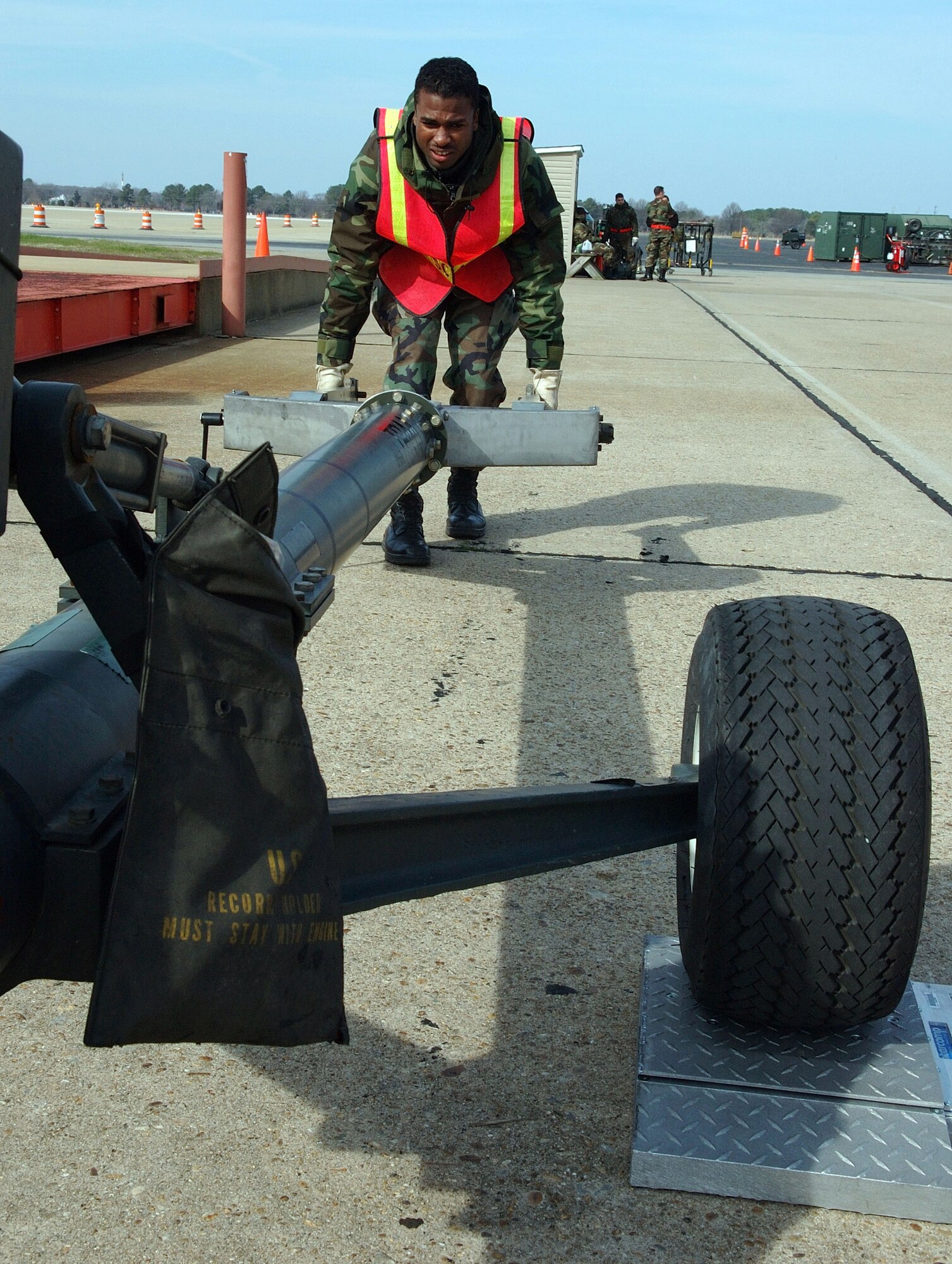 LANGLEY AIR FORCE BASE, Va. (AFPN) -- Airman 1st Class Jamal Huntley pushes a piece of mobile equipment during the Phase 1 operational readiness exercise. The Phase 1 ORE is an evaluation of the 1st Fighter Wing's ability to prepare and deploy personnel, equipment and support assets to a combat environment. Airman Huntley is with the base's ability to prepare and deploy personnel, equipment and support assets to a combat environment. Airman Huntley is with the 1st Component Maintenance Squadron. (U.S. Air Force photo by Senior Airman DeLicha Germany)