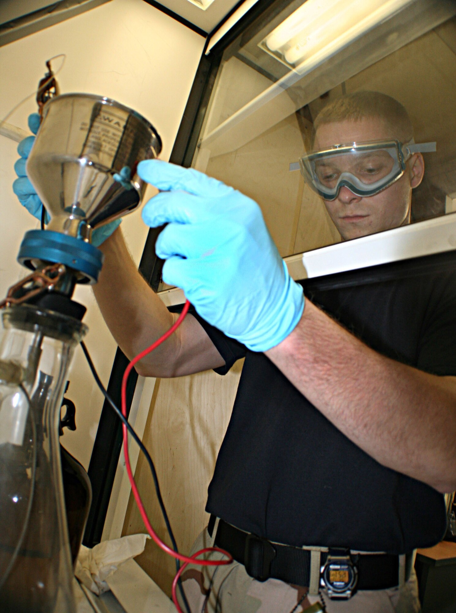 MANAS AIR BASE, Kyrgyzstan (AFPN) -- Staff Sgt. Ryan Smith filters fuel to check its purity. Before fuel can be considered Air Force quality, it must be inspected and mixed with performance-enhancing additives. Technicians in the 376th Air Expeditionary Wing's logistics readiness squadron here deliver about 4 million gallons of fuel monthly to KC-135 Stratotankers supporting Operation Enduring Freedom. (U.S. Air Force photo by Staff Sgt. Lara Gale)