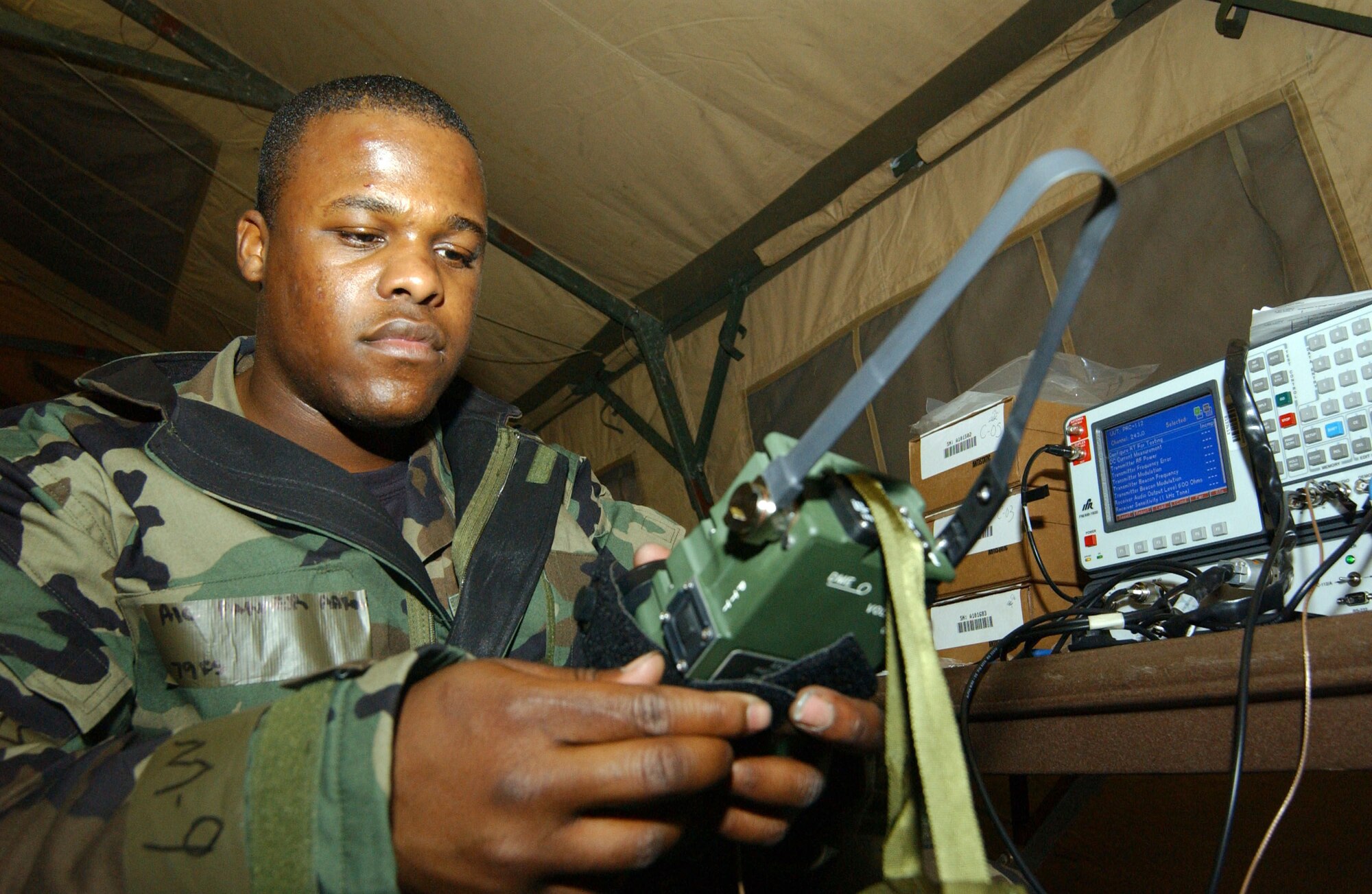 SHAW AIR FORCE BASE, S.C (AFPN) -- Airman 1st Class Aaron Parker performs initial testing for a PRC 112 radio during a Sea Lion exercise here.  Airman Parker is an aircrew life support apprentice.  (U.S. Air Force photo by Staff Sgt. Nathan Bevier)

