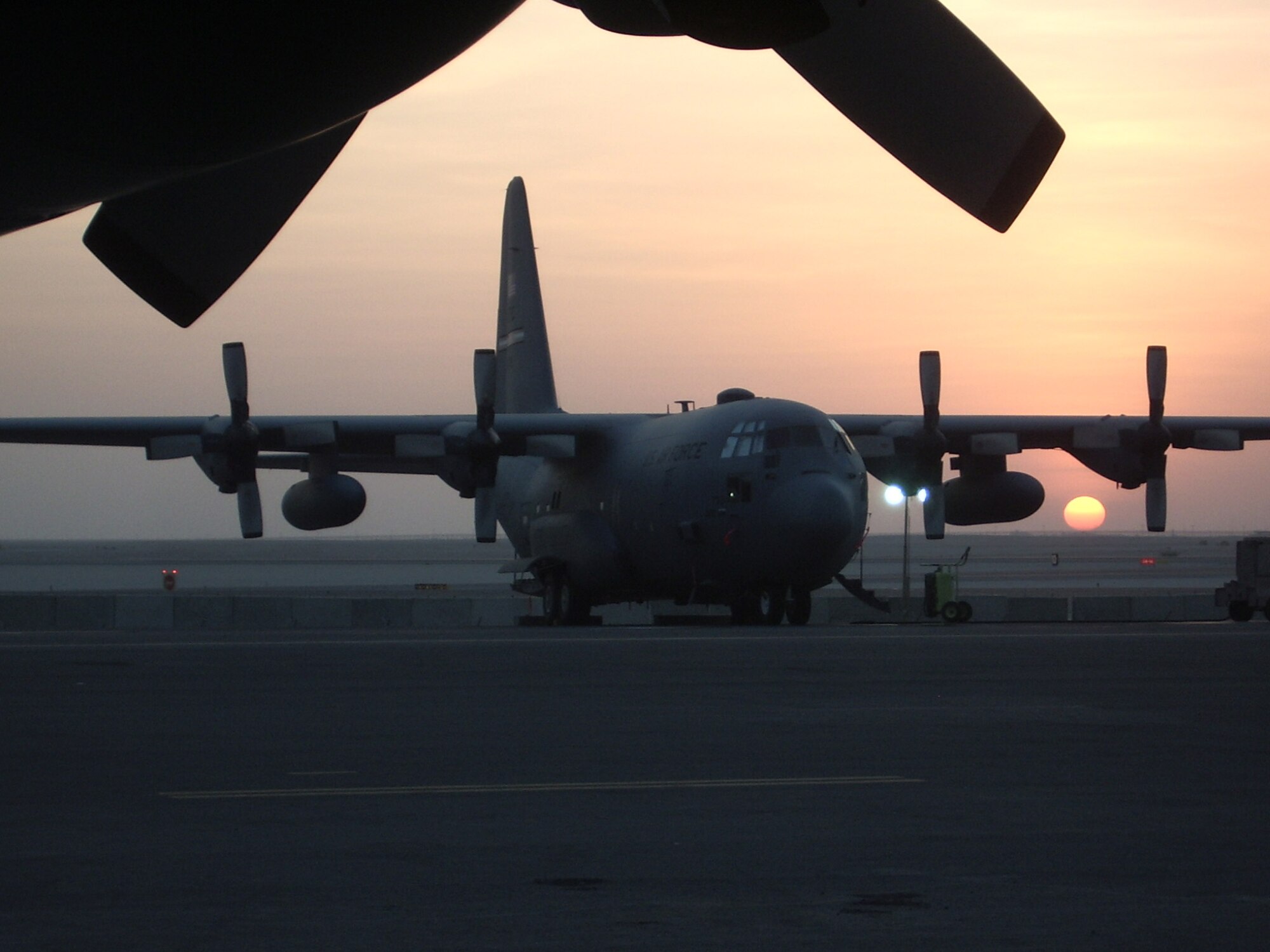 PETERSON AIR FORCE BASE, Colo. (AFRC) -- A 302nd Airlift Wing C-130 sits quietly at a deployment site in Southwest Asia. (U.S. Air Force photo by Maj. Ryan Tanton)