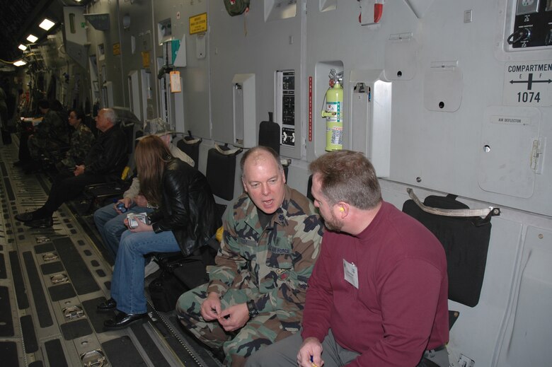 Chaplain (Lt. Col.) Carl Yost, 315th Airlift Wing chaplain talks with Clegg Taylor, chaplain for the Medical University of South Carolina aboard a C-17 Globemaster III during the 315th Airlift Wing's clergy day. (Photo by 1st Lt. Wayne Capps, USAFR)