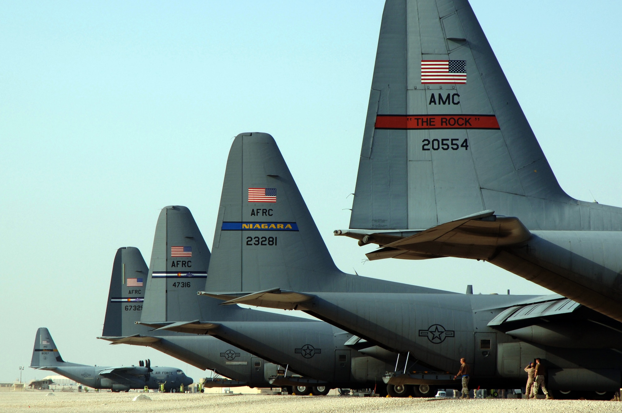 SOUTHWEST ASIA (AFPN) -- C-130 Hercules from various Air  Force units sit on the flightline at a deployed location Feb. 5. (U.S. Air Force photo by Staff Sgt. Joshua Strang)