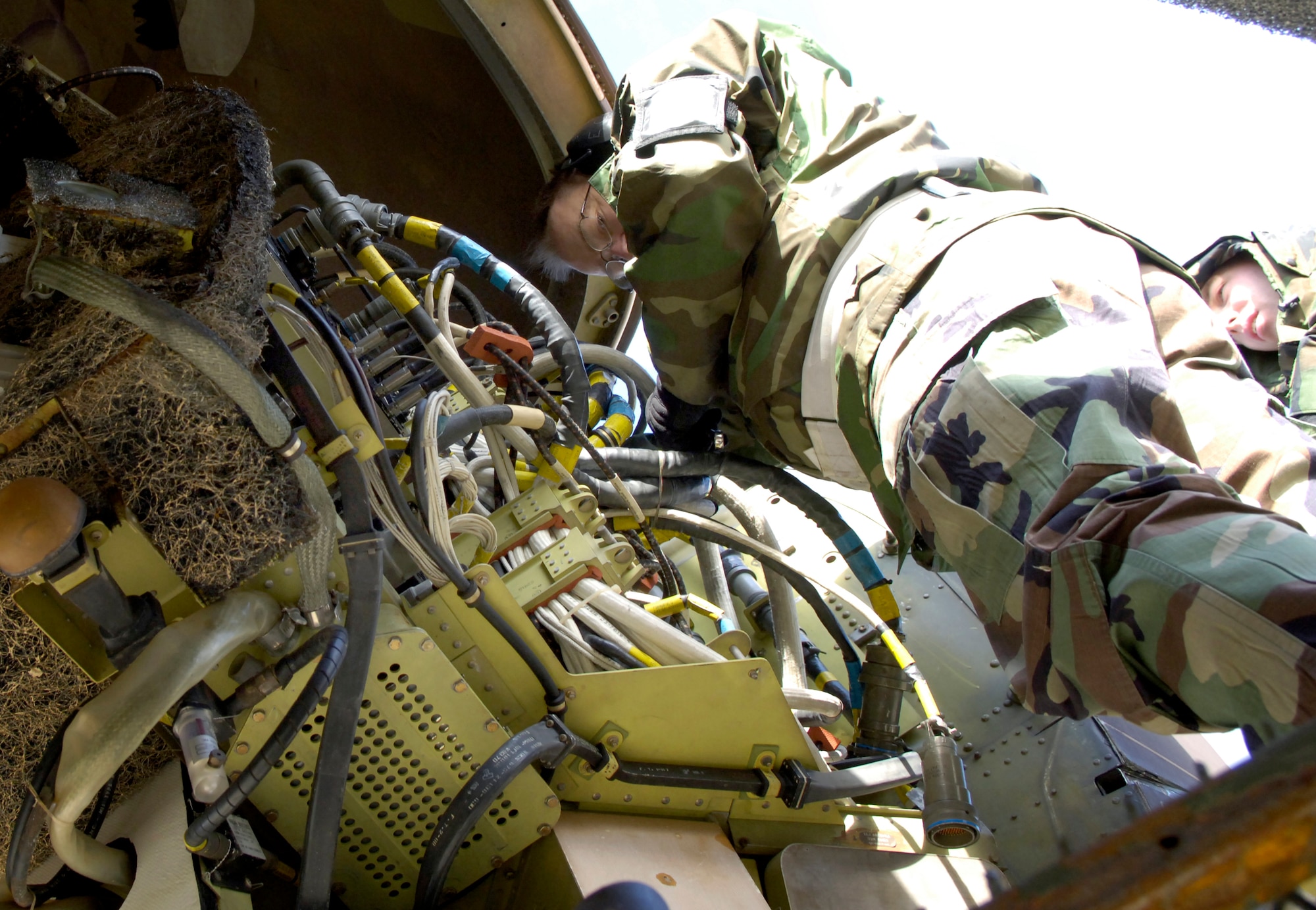 BARKSDALE AIR FORCE BASE, La. (AFPN) -- Tech. Sgt. James Sykes and Airman 1st Class Joseph Norman perform maintenance on a B-52H Stratofortress Feb. 4.  The Airmen are Reservists assigned to the 917th Aircraft Maintenance Squadron here. (U.S. Air Force photo by Senior Airman Brian Ferguson)