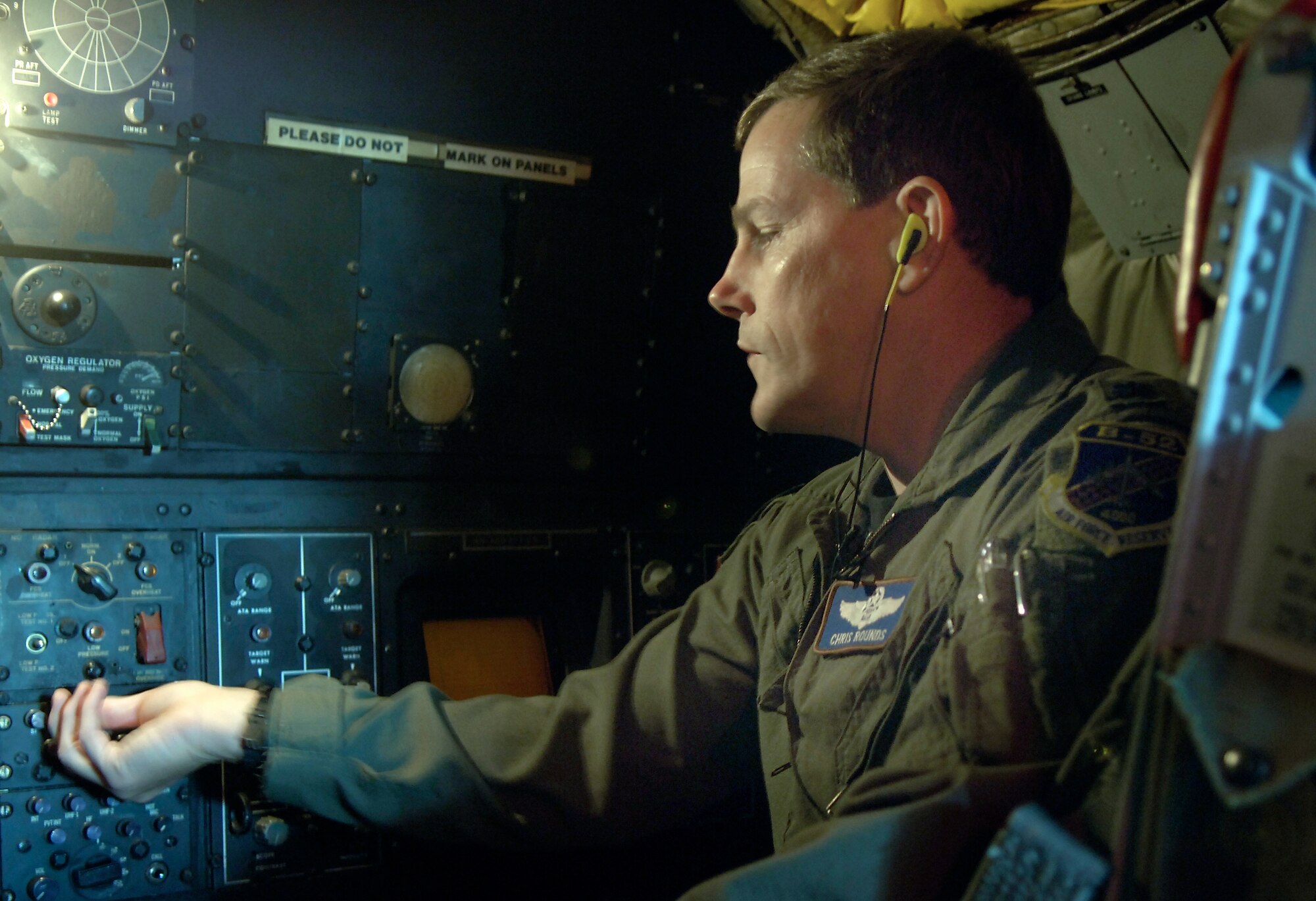 BARKSDALE AIR FORCE BASE, La. (AFPN) -- Lt. Col. Chris Rounds turns down the volume on his radio before takeoff. The colonel said he does not need as much volume as before due to the Air Force's newly approved attenuating custom communications earpiece system, or ACCES. Each earpiece is custom-fit to the individual's ear canal and contains a built-in speaker. When connected to an aircraft's communication system, it helps to enhance radio fidelity. The system also reduces ambient noise, increases situational awareness and protects against potential hearing loss. Colonel Rounds is assigned to the 93rd Bomb Squadron. (U.S. Air Force photo by Senior Airman Brian Ferguson)