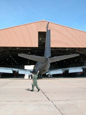 With air horn in one hand to alert others if necessary, a maintenance member of the 507th Air Refueling Wing offers a thumbs up, indicating this KC-135 is on the right path as it's being towed into the hangar for repairs. The Air Force also gave the 507th ARW a thumbs up recently, presenting the wing with an Air Force Meritorious Unit Award for superior performance.