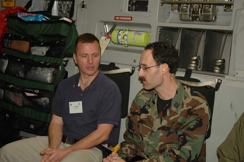 Chaplain (Capt.) Craig Abee, chaplain with the 315th Airlift Wing talks to Tim Sadeno aboard a C-17 Globemaster III during the 315th Airlift Wing's clergy day. (Photo by 1st Lt. Wayne Capps)