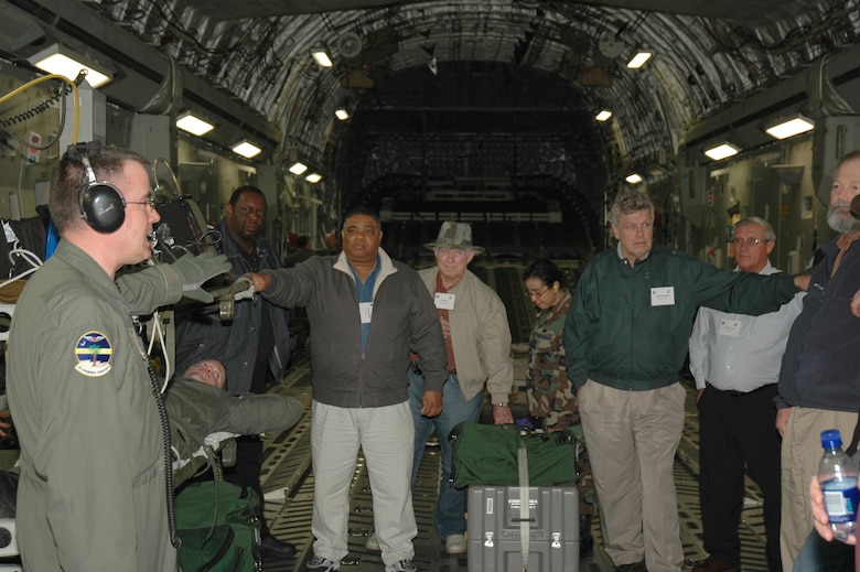 Members of the 315th Aeromedical Evacuation Squadron give a demonstration to South Carolina pastors aboard a C-17 Globemaster III during the 315th Airlift Wing's clergy day. (Photo by 1st Lt. Wayne Capps, USAFR)