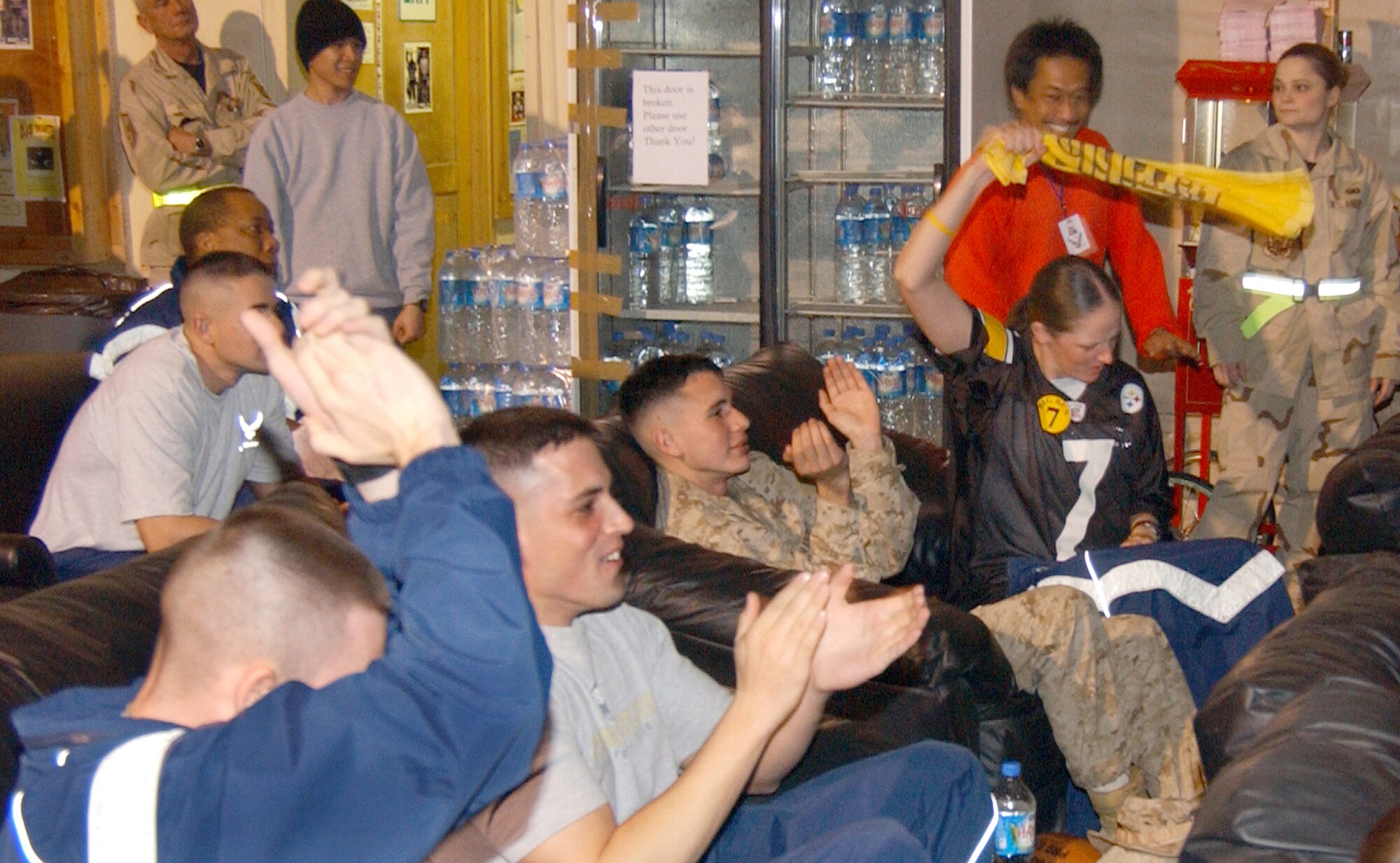 BALAD AIR BASE, Iraq (AFPN) -- Servicemember football fans celebrate in the recreation tent here during Super Bowl XL. The Pittsburgh Steelers defeated the Seattle Seahawks 21-10 in Sunday's game. (U.S. Air Force photo by Tech. Sgt. Steve Horton)                             