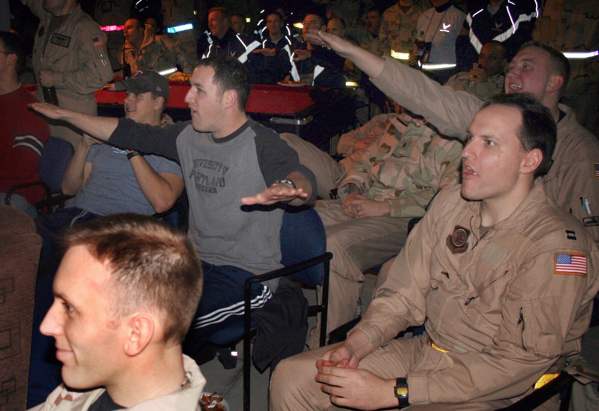 MANAS AIR BASE, Kyrgyzstan (AFPN) -- A C-17 Globemaster III crew disagrees with the referees after the Steeler's first touchdown in Super Bowl XL. Airmen here said they were disappointed to miss the parties at home, but glad to be on the ground for the game. The crew is with the 4th Airlift Squadron at McChord Air Force Base, Wash. (U.S. Air Force photo by Staff Sgt. Lara Gale)