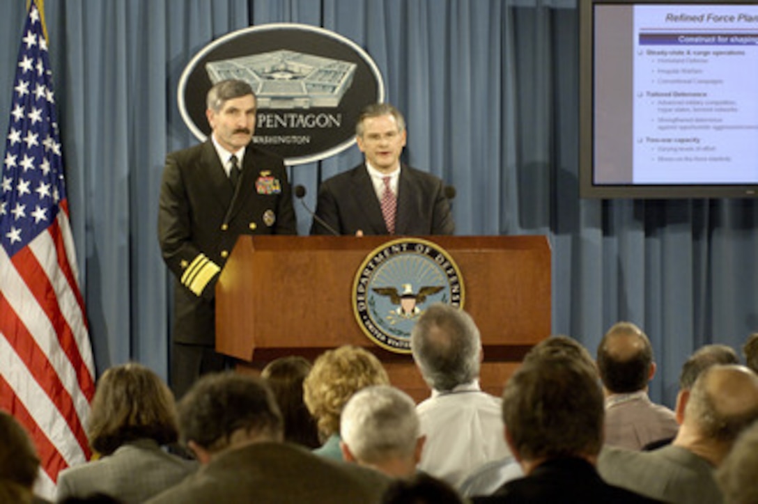 Deputy Under Secretary of Defense for Policy Ryan Henry (right) and the Joint Staff Director for Force Structure, Resources and Assessment Vice Adm. Evan Chanik (left), U.S. Navy, brief reporters in the Pentagon on some of the key findings of the Quadrennial Defense Review on Feb. 3, 2006. The review looks at developing trends in the global security situation and recommends courses of action to be followed by the Department of Defense to effectively meet the challenges ahead. 