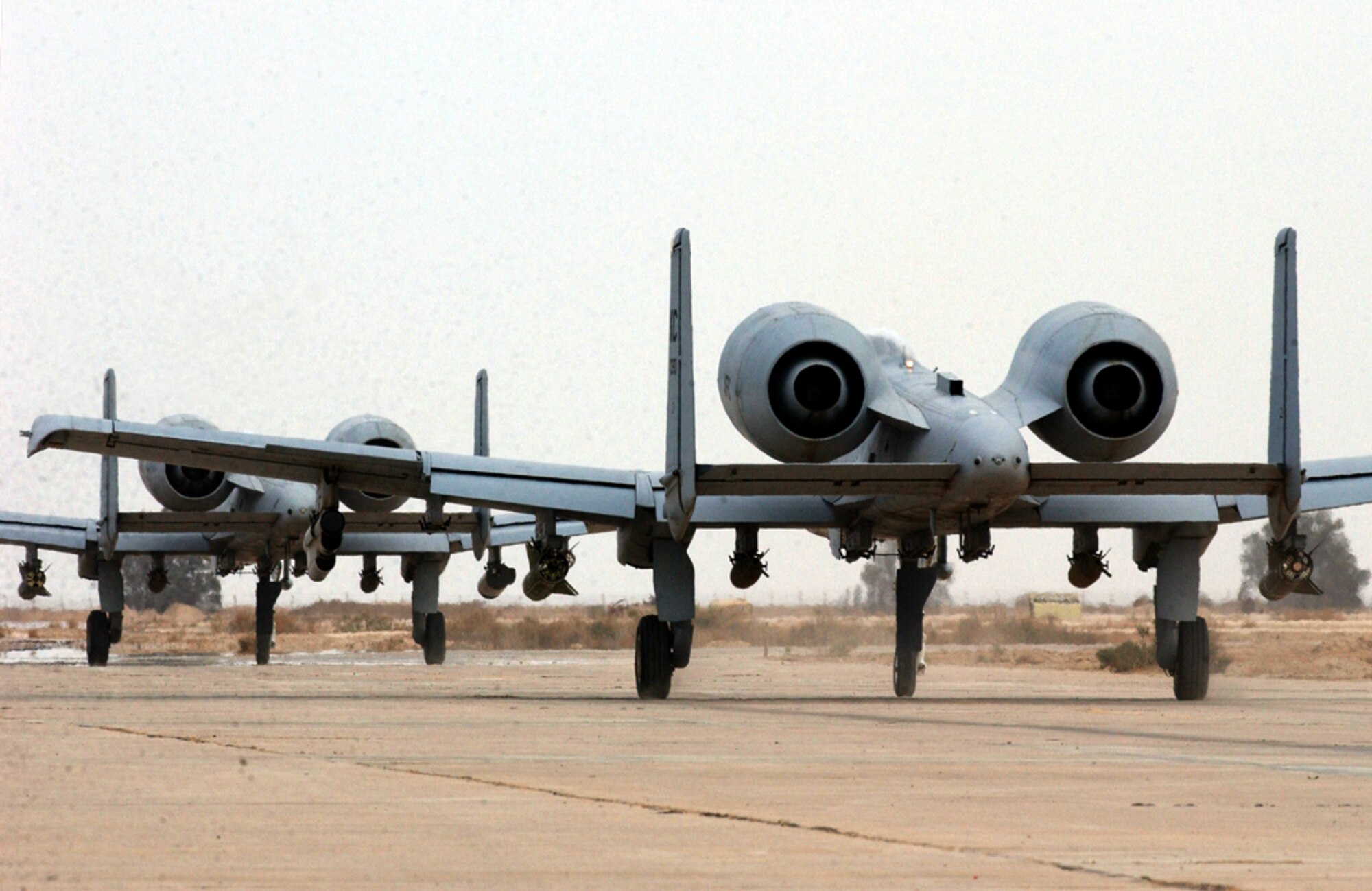 OPERATION IRAQI FREEDOM -- A-10 Thunderbolt IIs from the 442nd Fighter Wing taxi before a combat mission over Iraq on April 18.  The 442nd FW from Whiteman Air Force Base, Mo., was deployed to Tallil and Kirkuk Air Bases in Iraq in 2003.  (U.S. Air Force photo by Master Sgt. Terry L. Blevins)