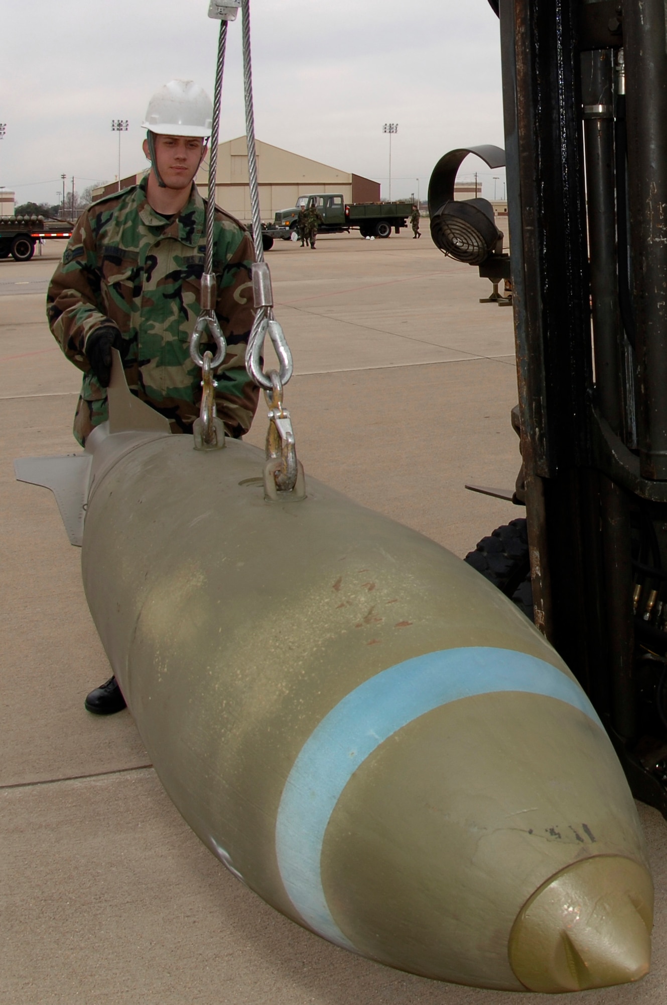 BARKSDALE AIR FORCE BASE, La. (AFPN) -- Airman 1st Class Christopher Marett unloads and transports an M-117 bomb. The munitions are on display with the B-52 Stratofortress to show its full capabilities. Airman Marett is with the 2nd Munitions Squadron here. (U.S. Air Force photo by Tech. Sgt. Robert J. Horstman)
