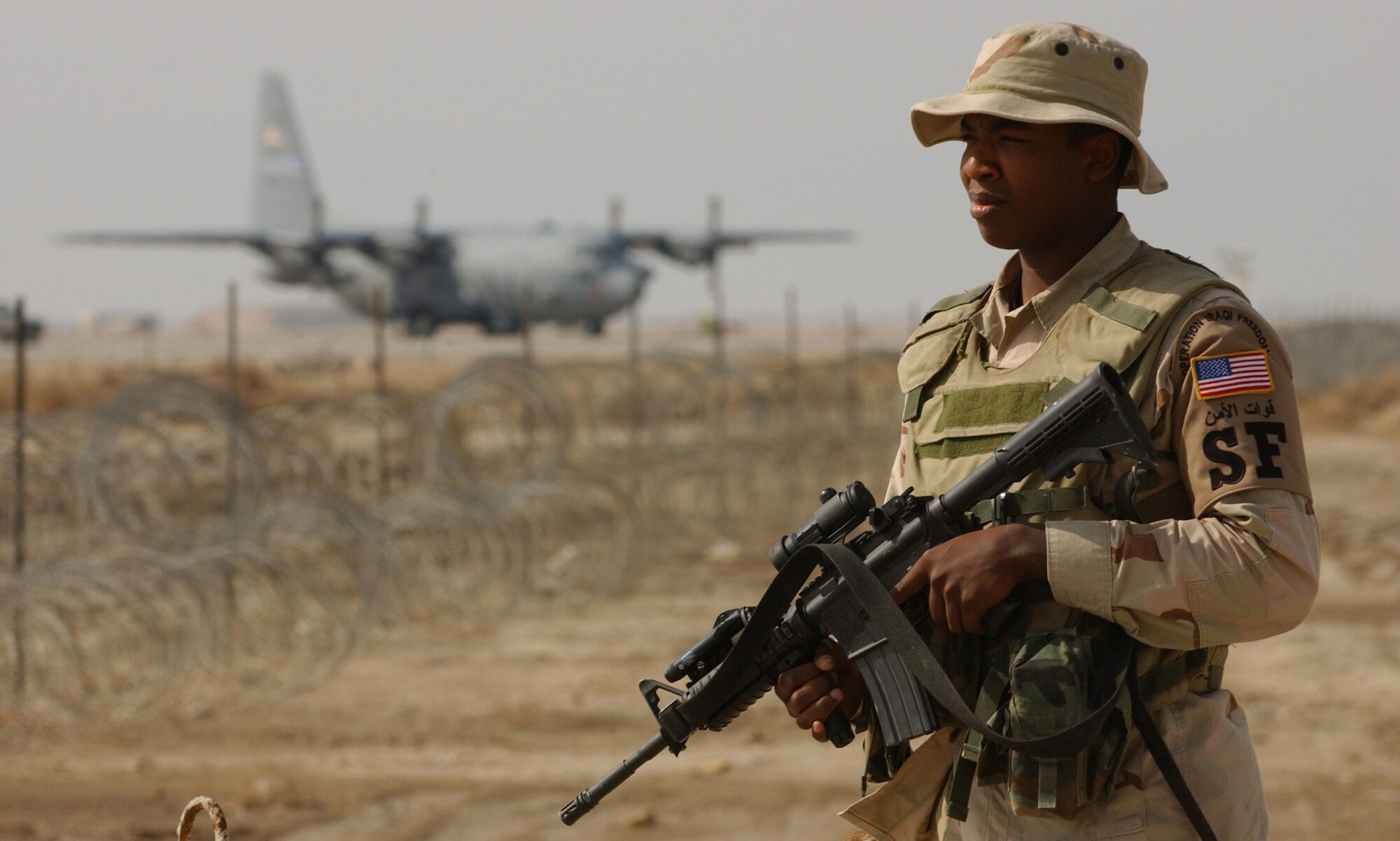 ALI AIR BASE, Iraq -- Airman 1st Class Gherjuaen Robinson guards an entry control point here Feb. 1. Airman Robinson is with the 407th Expeditionary Security Forces Squadron. (U.S. Air Force photo by Staff Sgt. Bradley C. Church)
