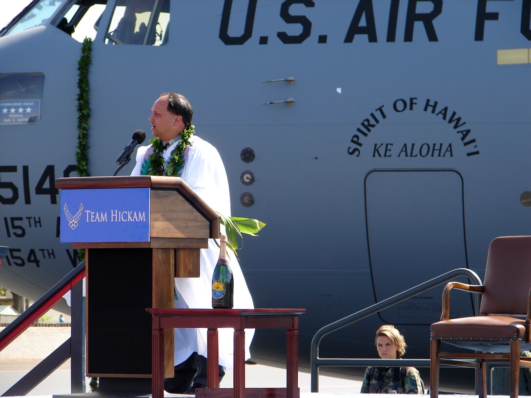HICKAM AIR FORCE BASE, Hawaii (AFPN) -- The Kahu Kordell Kekoa explains the significance behind the traditional Hawaiian blessing, which he administer to PACAF's new C-17. (U.S. Air Force photo by Maj. Brad Jessmer)